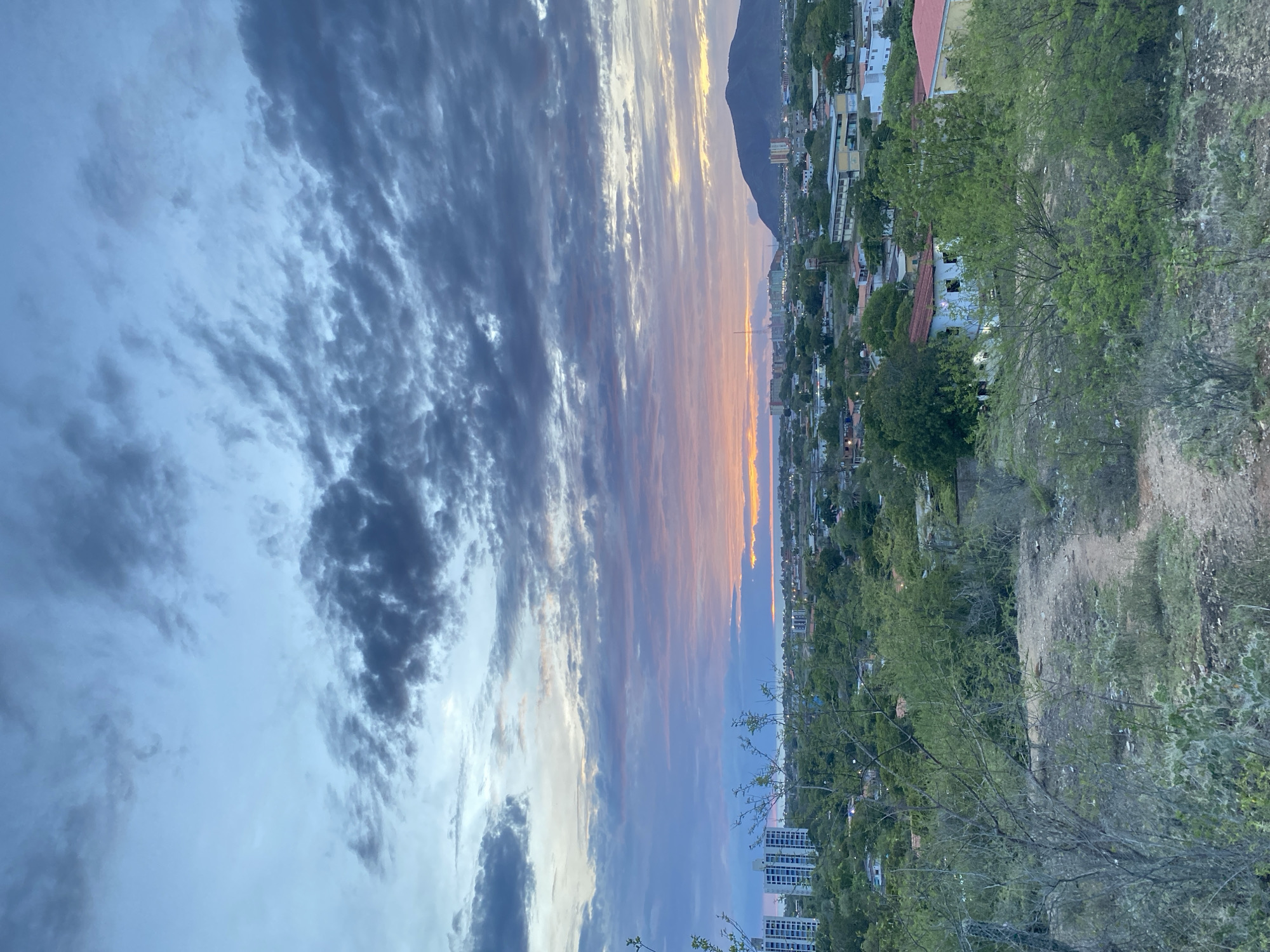 Sunset over Juan Griego, with a puppy cameo nearby