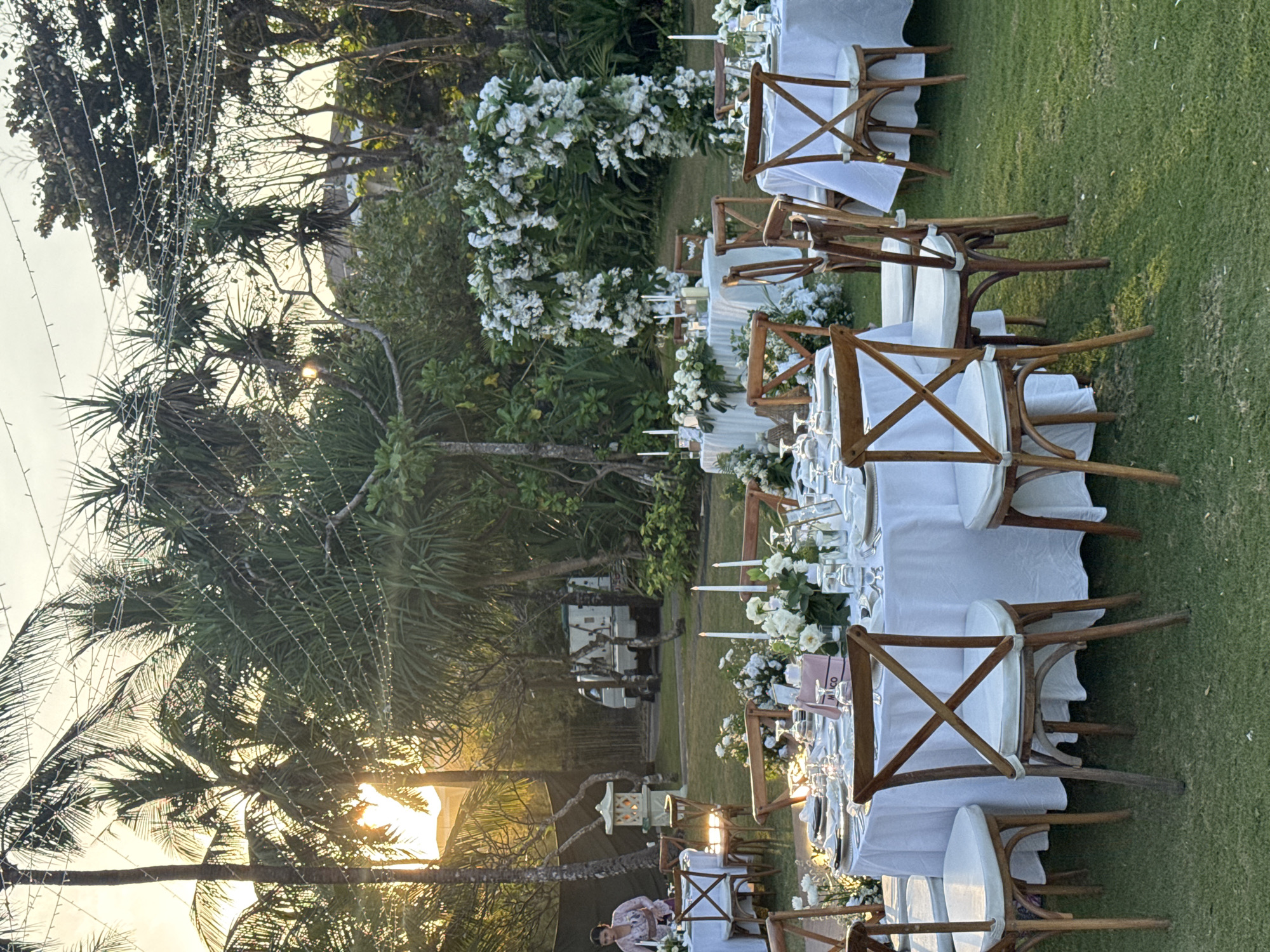 Bali beachfront resort at golden hour, wedding setup and all