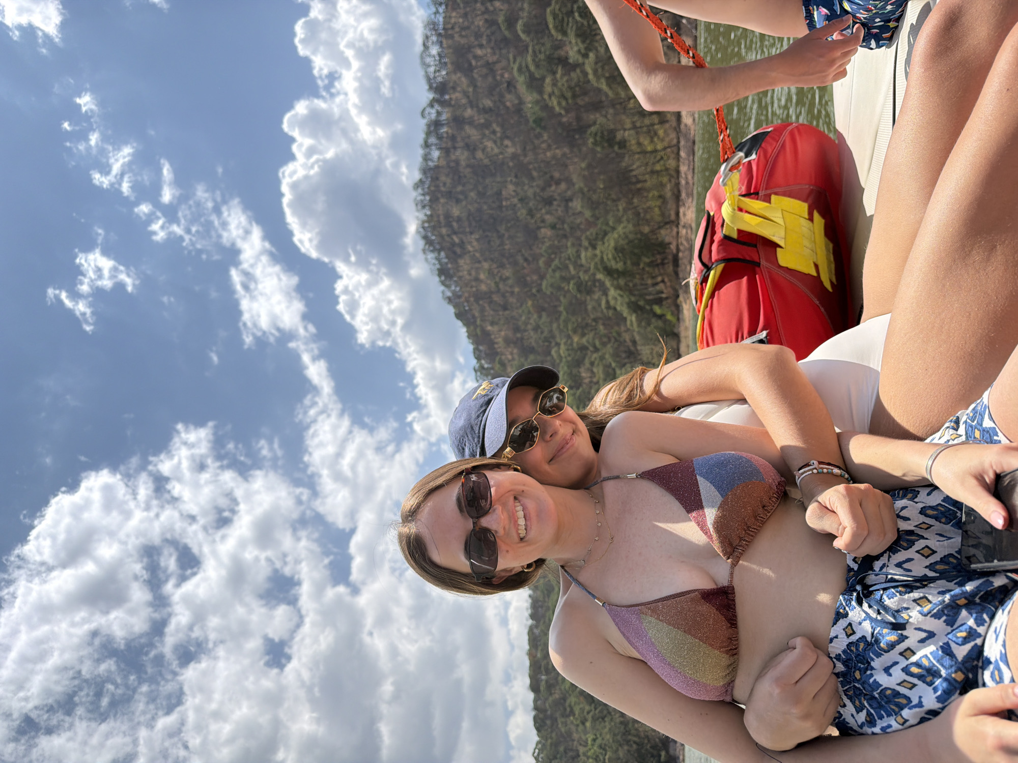 Friends take selfies while boating on Lake Avándaro