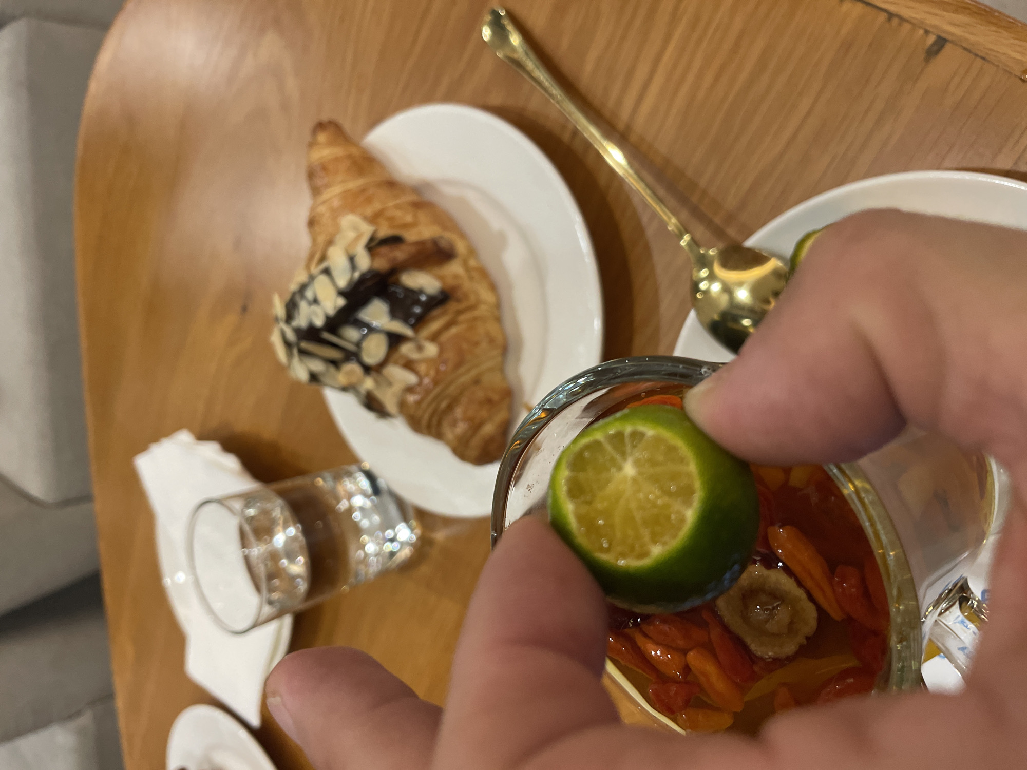Fruit tea and croissants at a modern Nha Trang café