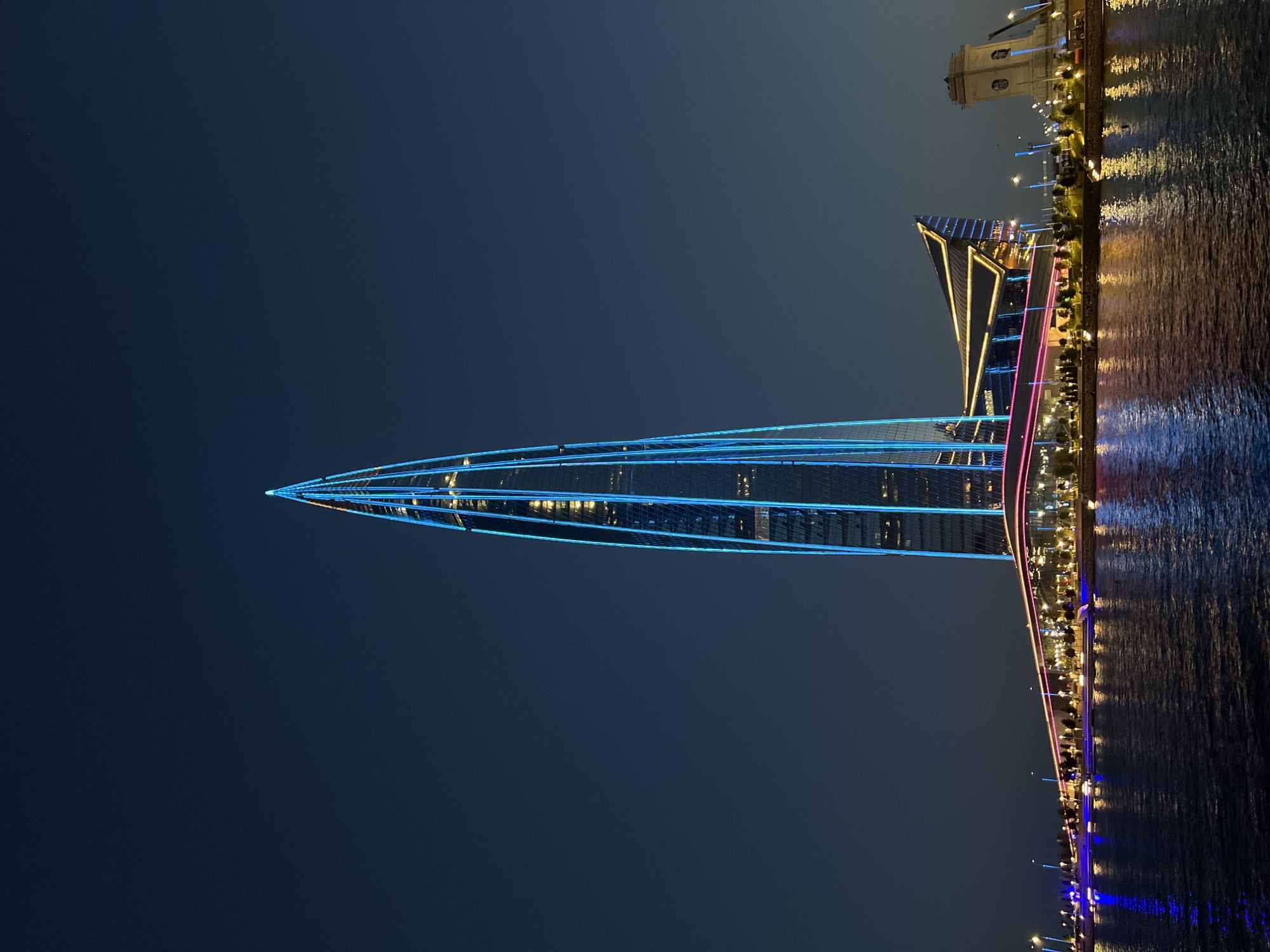 Lakhta Center glows in blue and pink against the St. Petersburg night