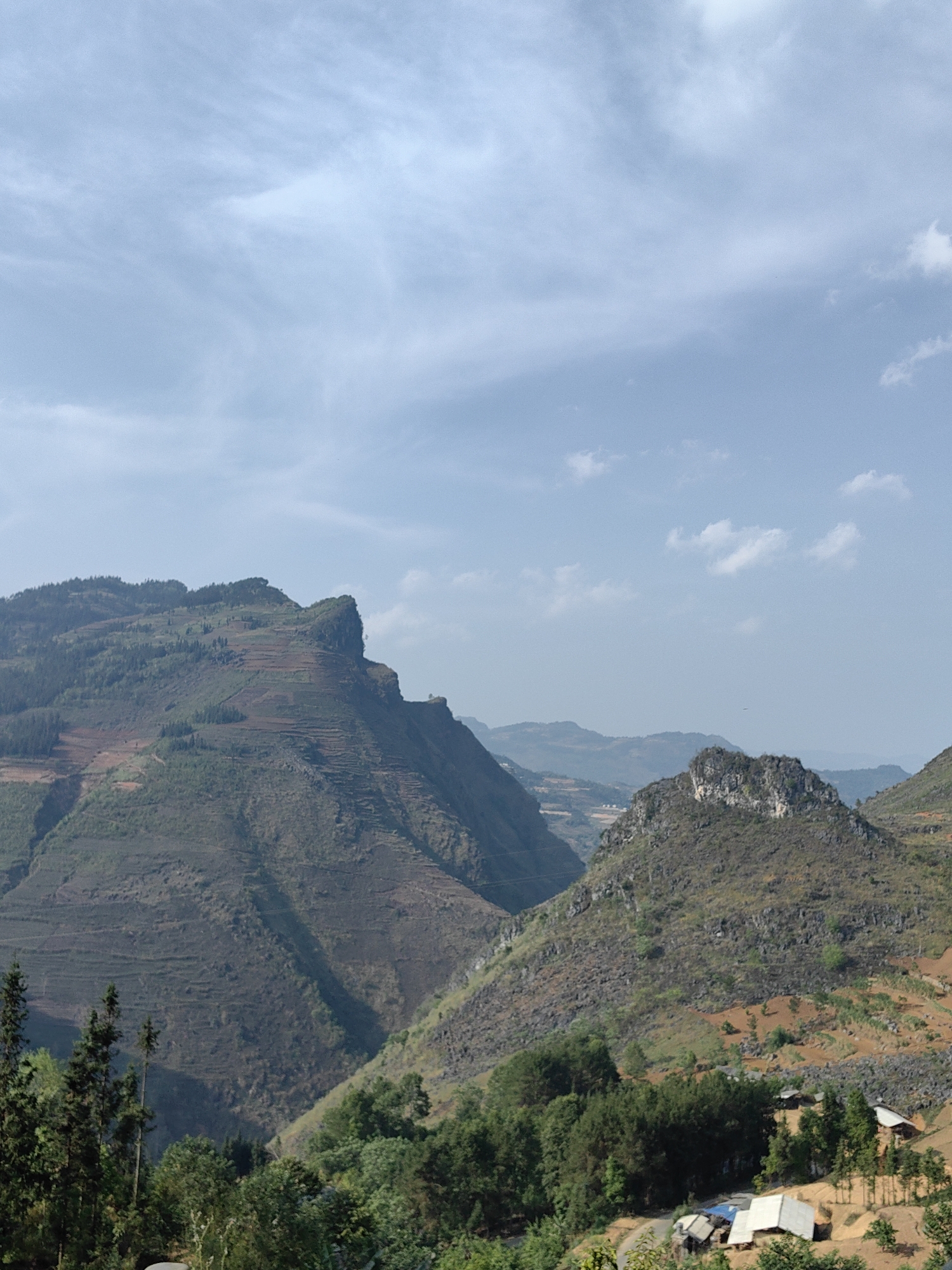 Morning traffic flows through terraced mountains in Đồng Văn