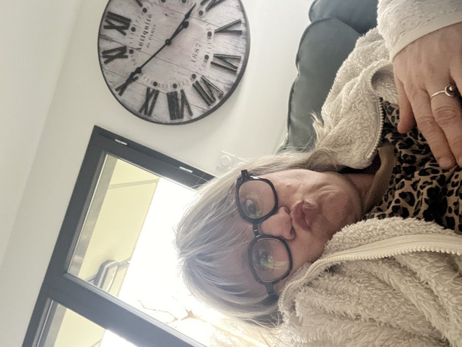 Woman enjoys quiet Sunday at home with pets in France