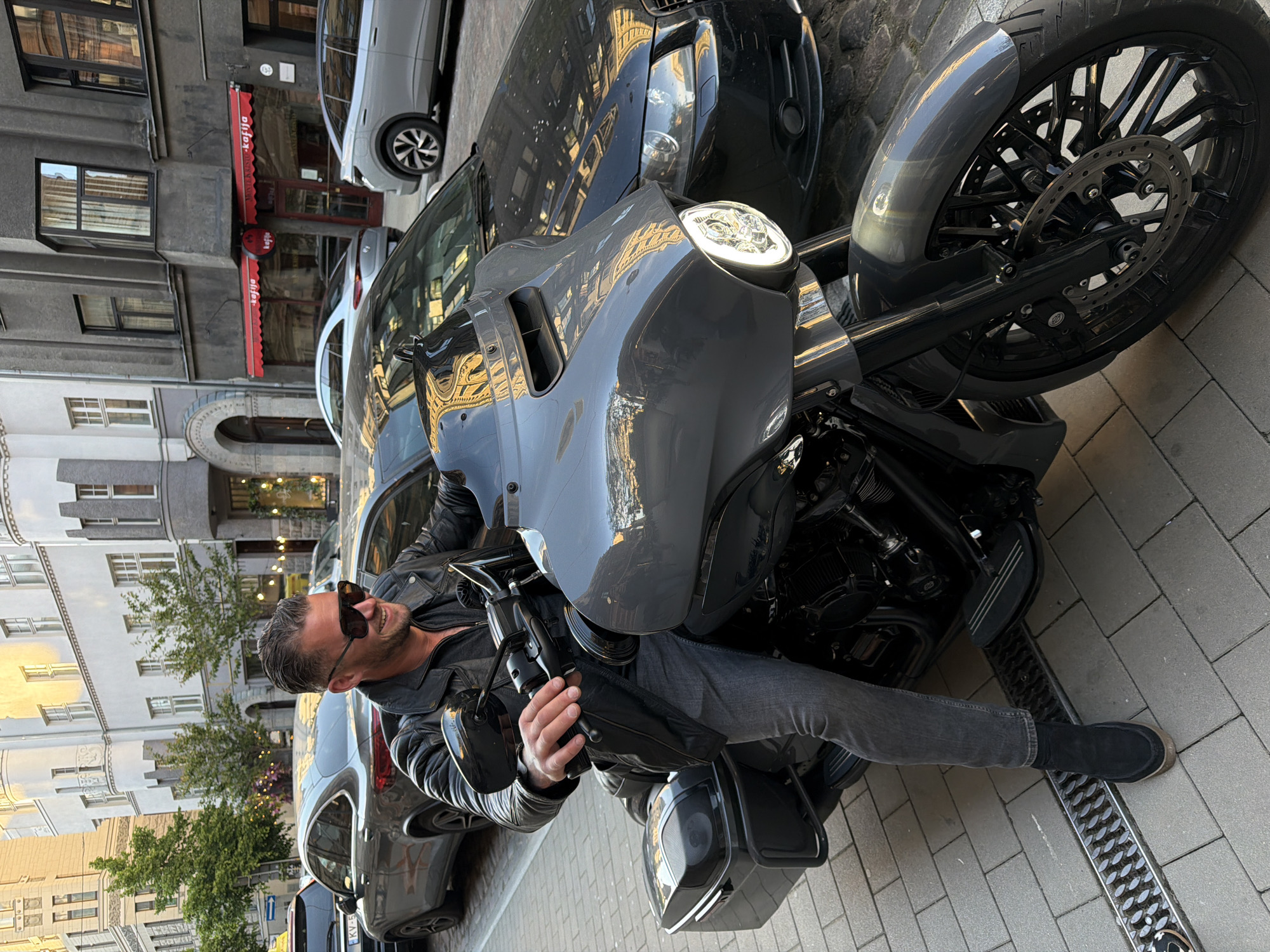 Motorcyclist enjoys afternoon refreshments in Riga