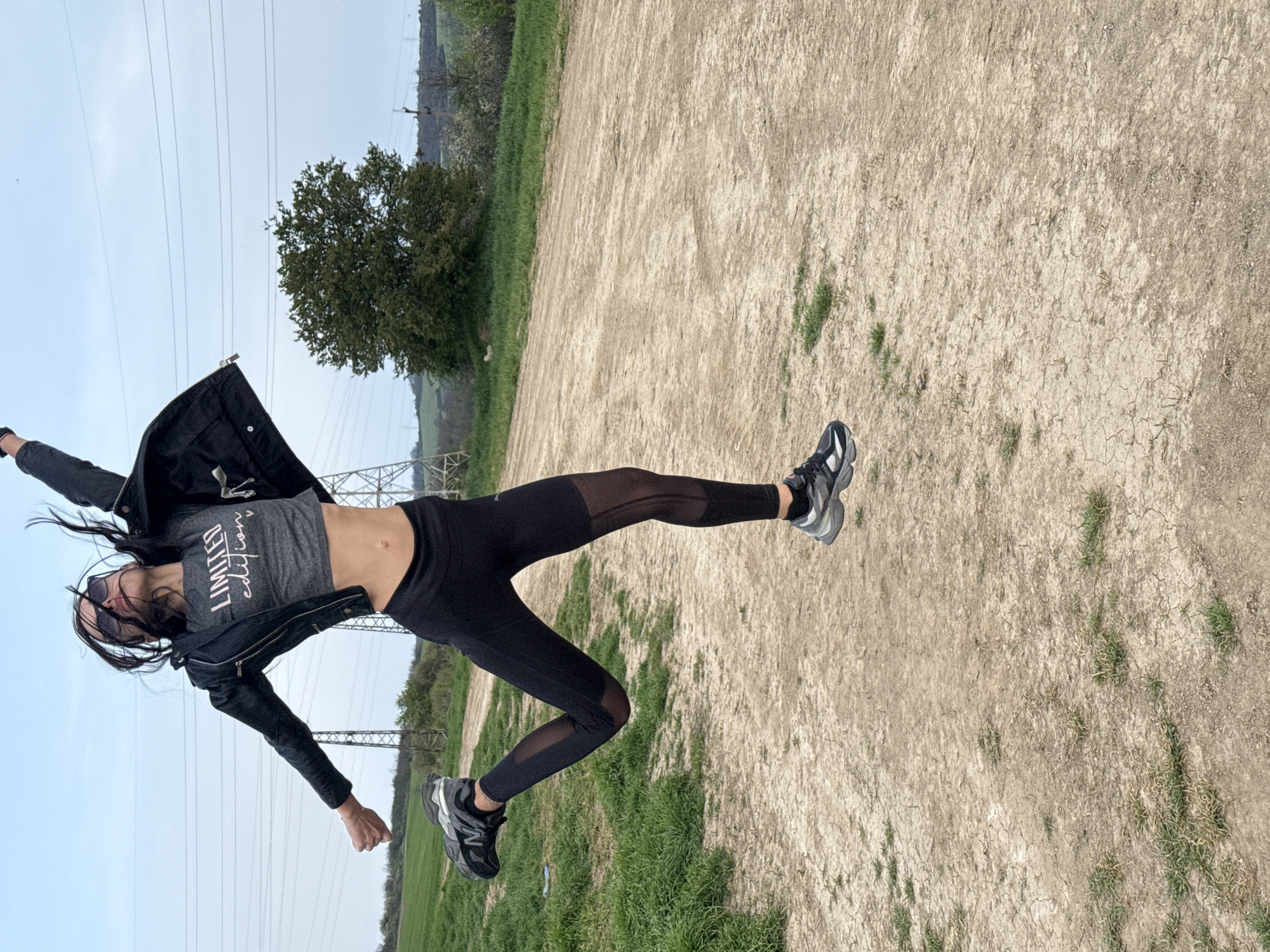 Woman photographed in dynamic outdoor poses in Pleven field