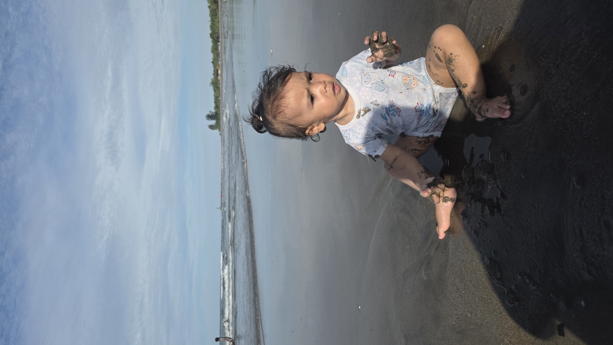 Child plays, crabs scuttle across Indonesian beaches Sunday morning