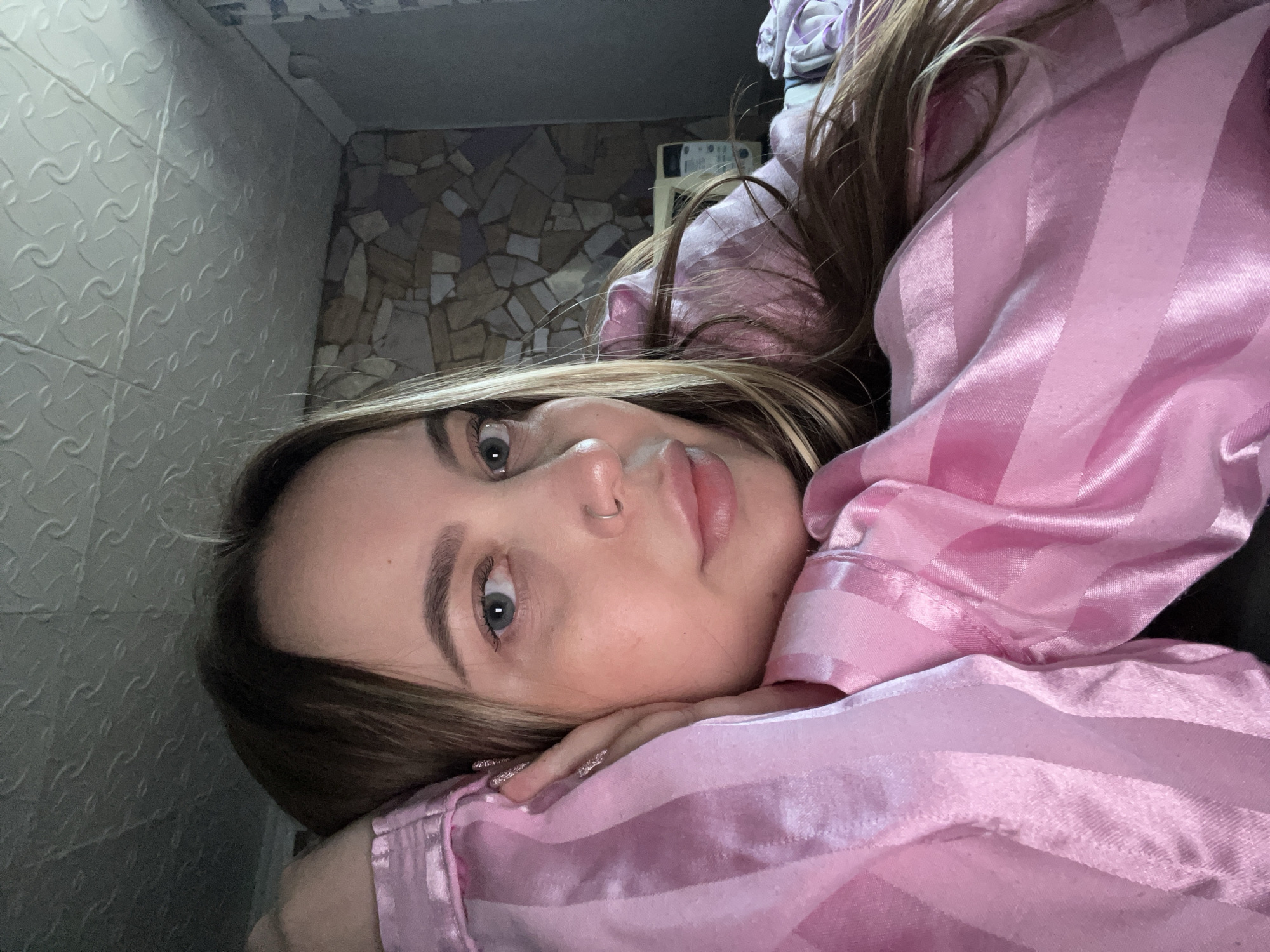 Woman in pink jacket photographed during spring day in Russia