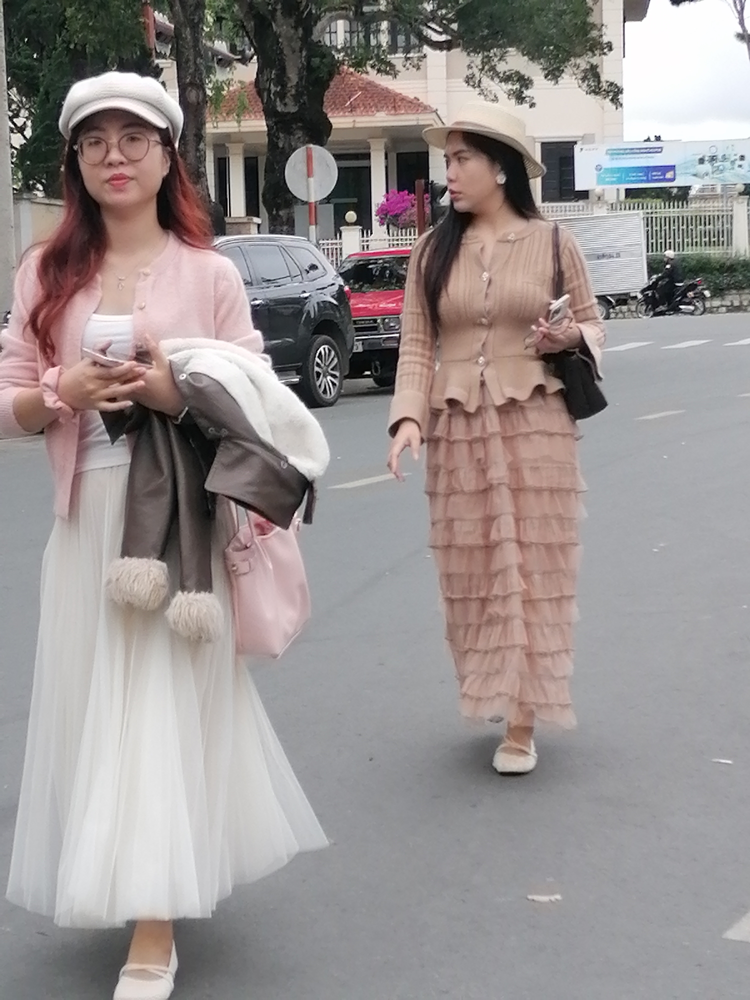 Street life on a Da Lat morning: riders, pedestrians, and custom rides