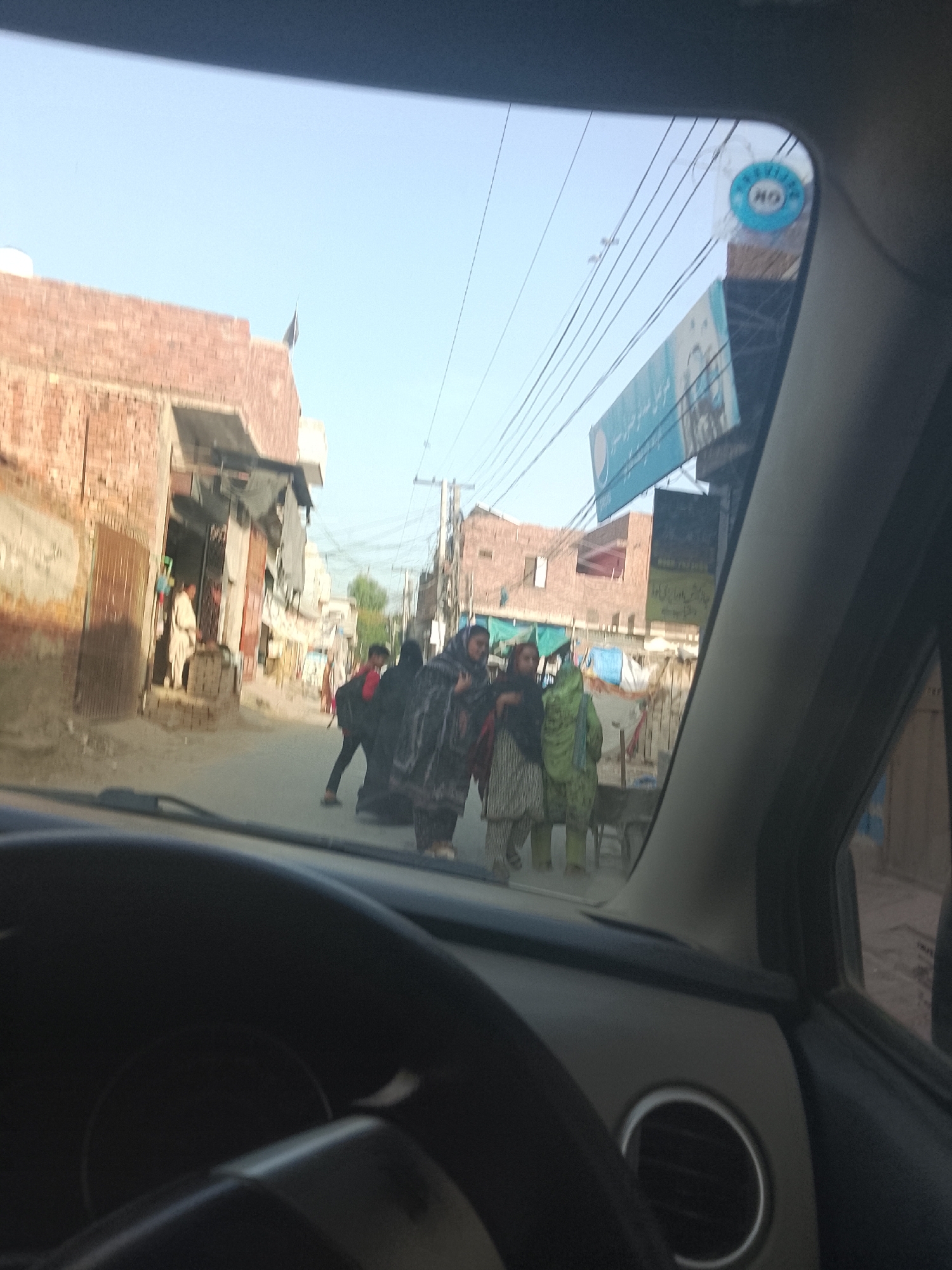Urban street scenes captured during morning commute in South Asian city