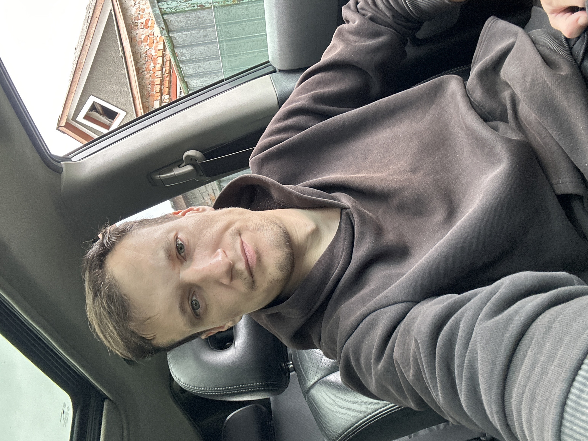 Parked in Makiv: repeated selfies from a car's driver seat