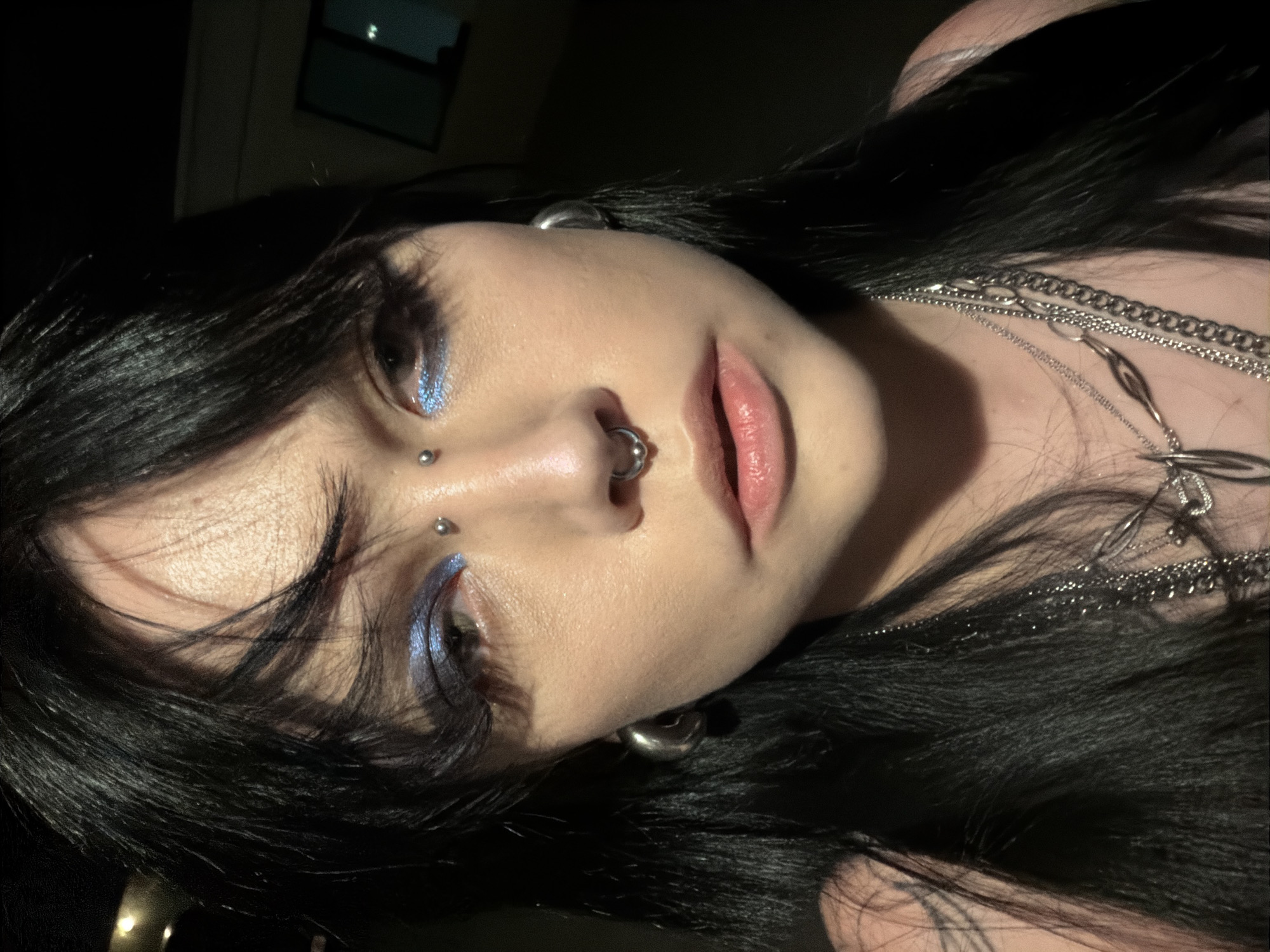 Late-night selfie series, facial piercings and layered silver necklaces