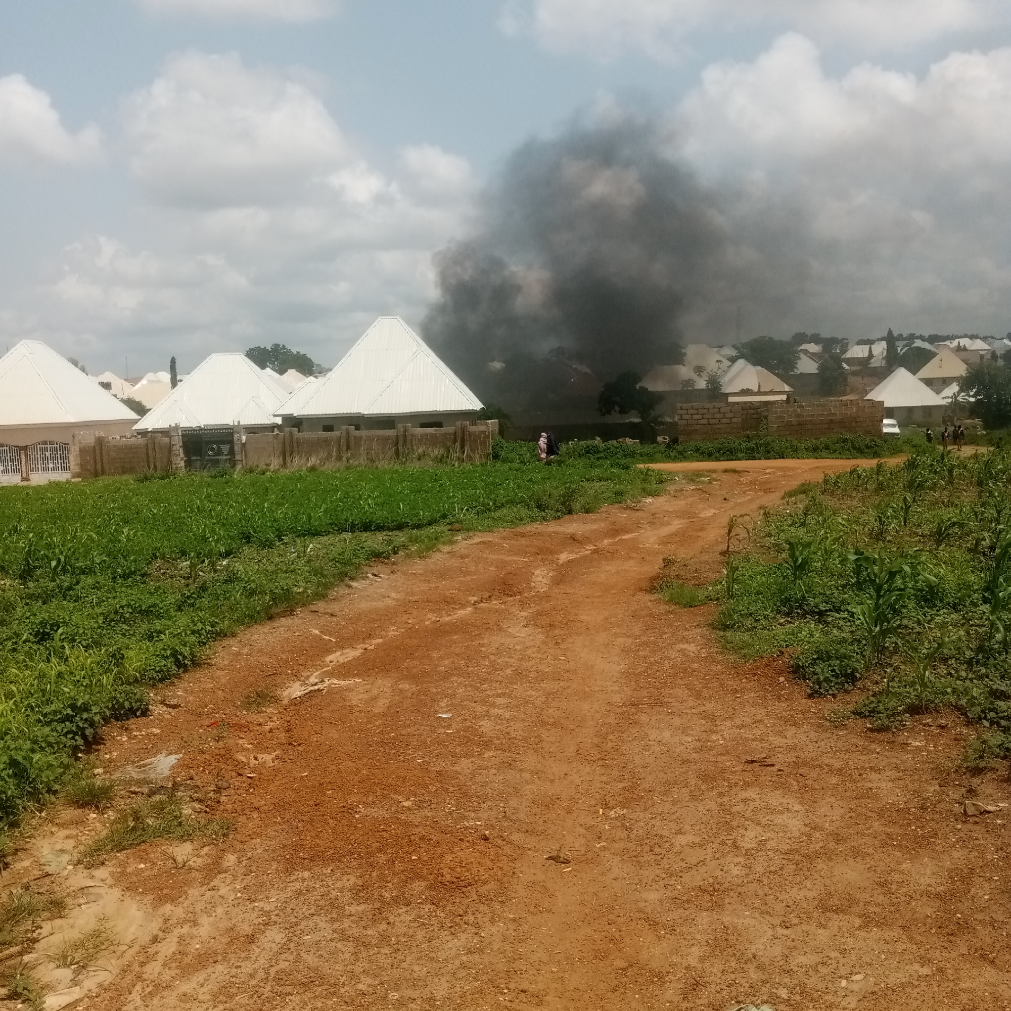 Residential fire burns in Akwanga, Nigeria, smoke visible across neighborhood