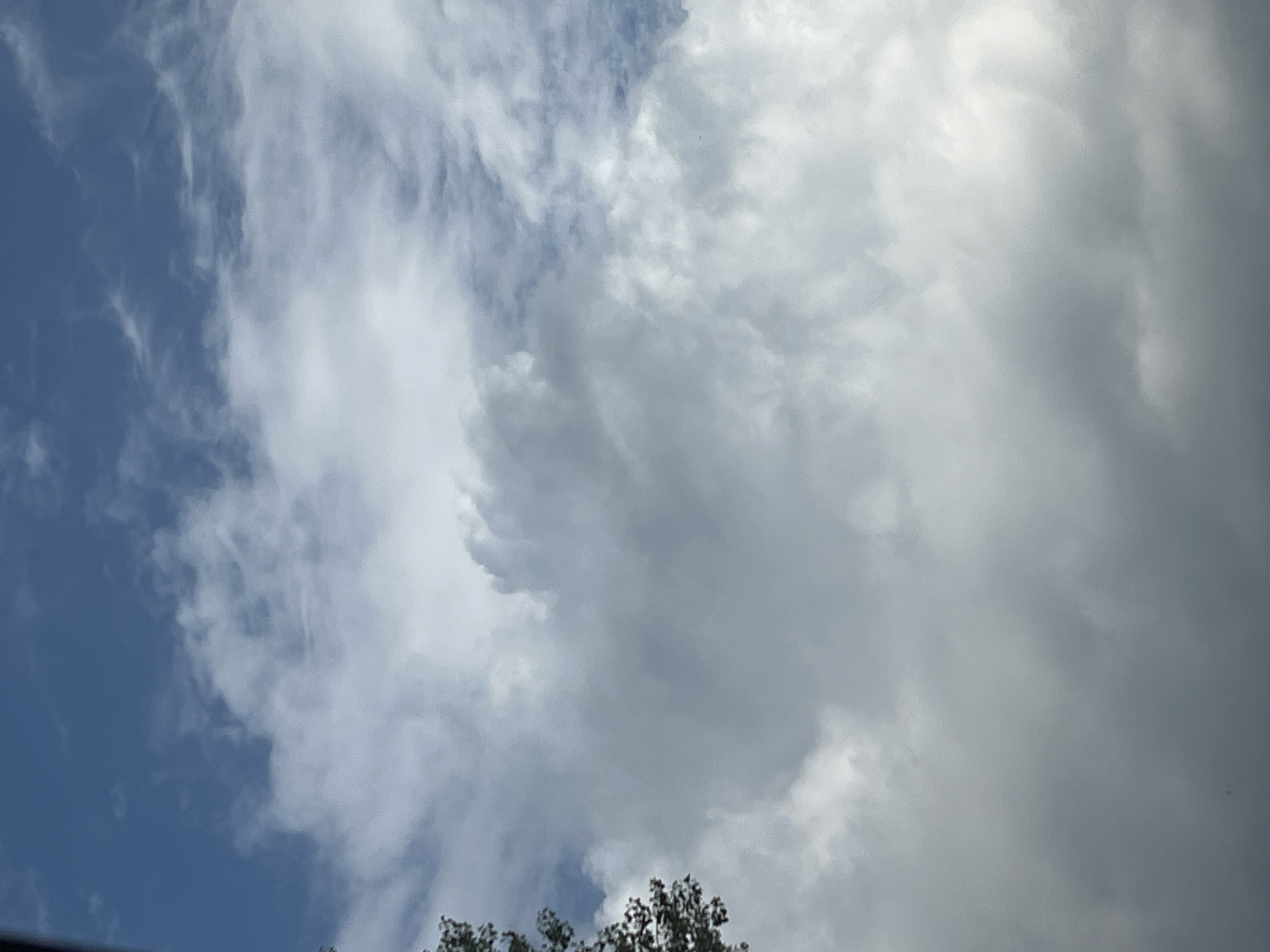 Warsaw morning sky turns stormy, captured from street and above