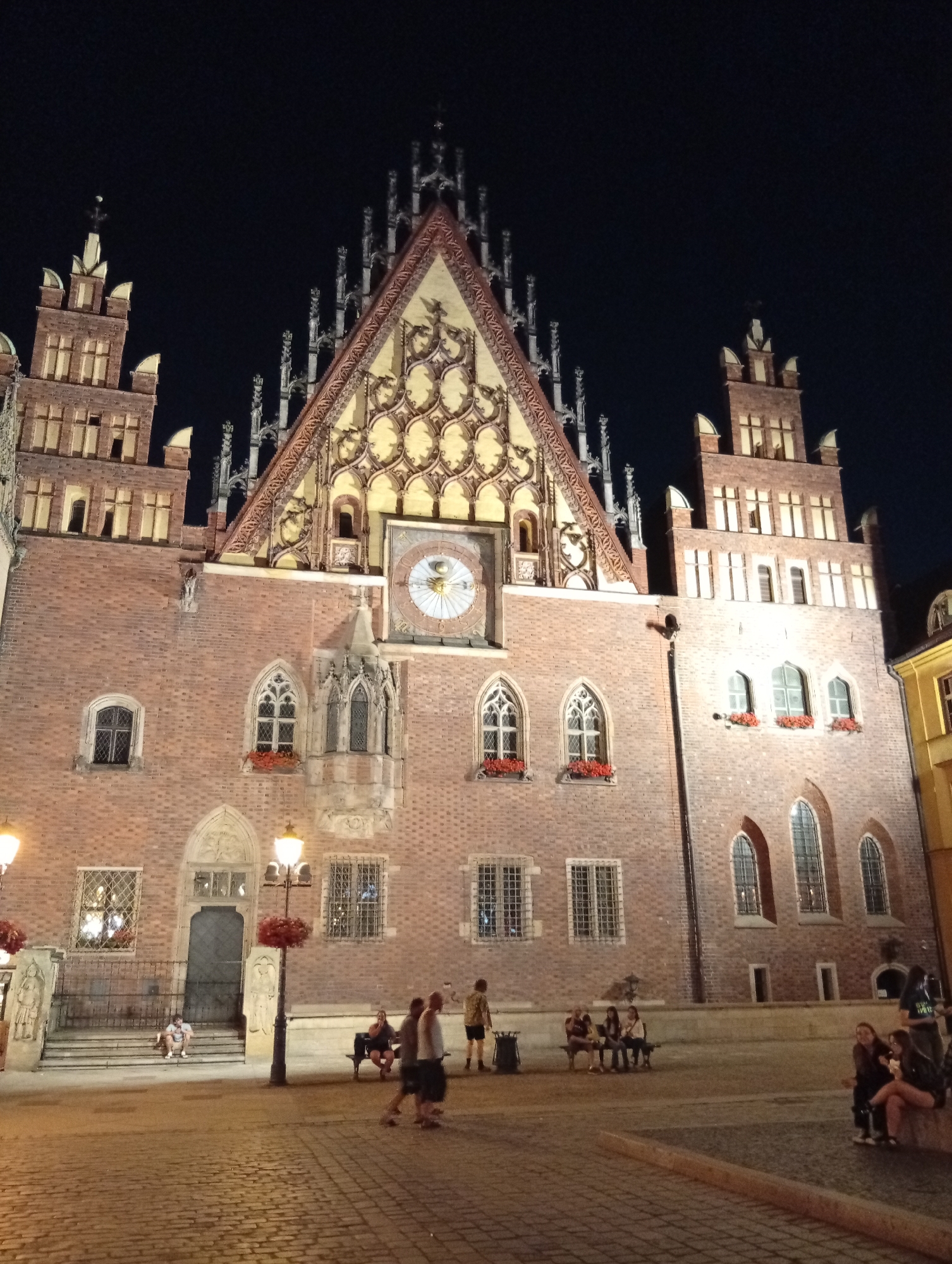 Handpan music outside Wrocław's Gothic Old Town Hall at night