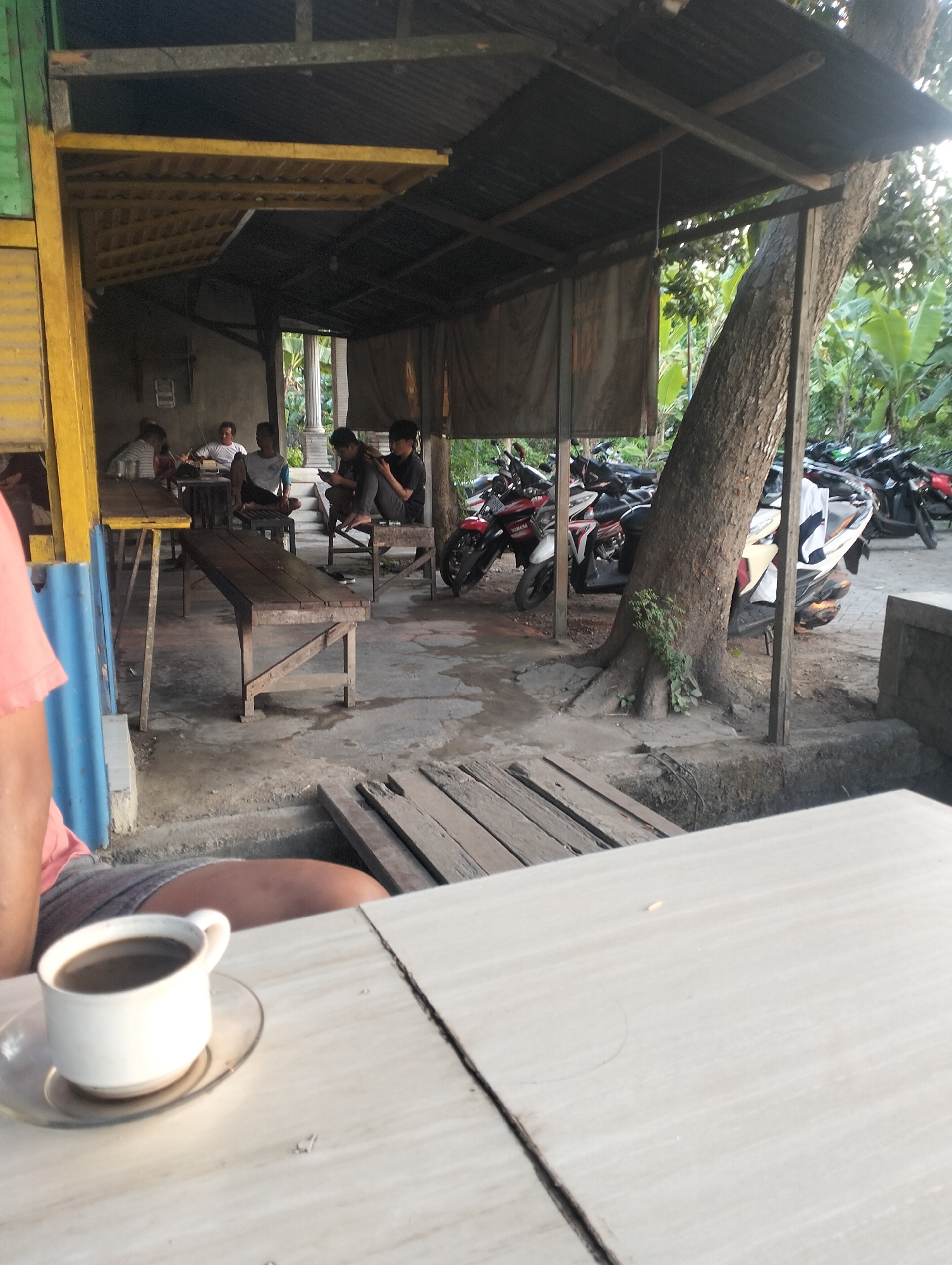 Morning coffee stop at a rural Indonesian neighborhood hangout