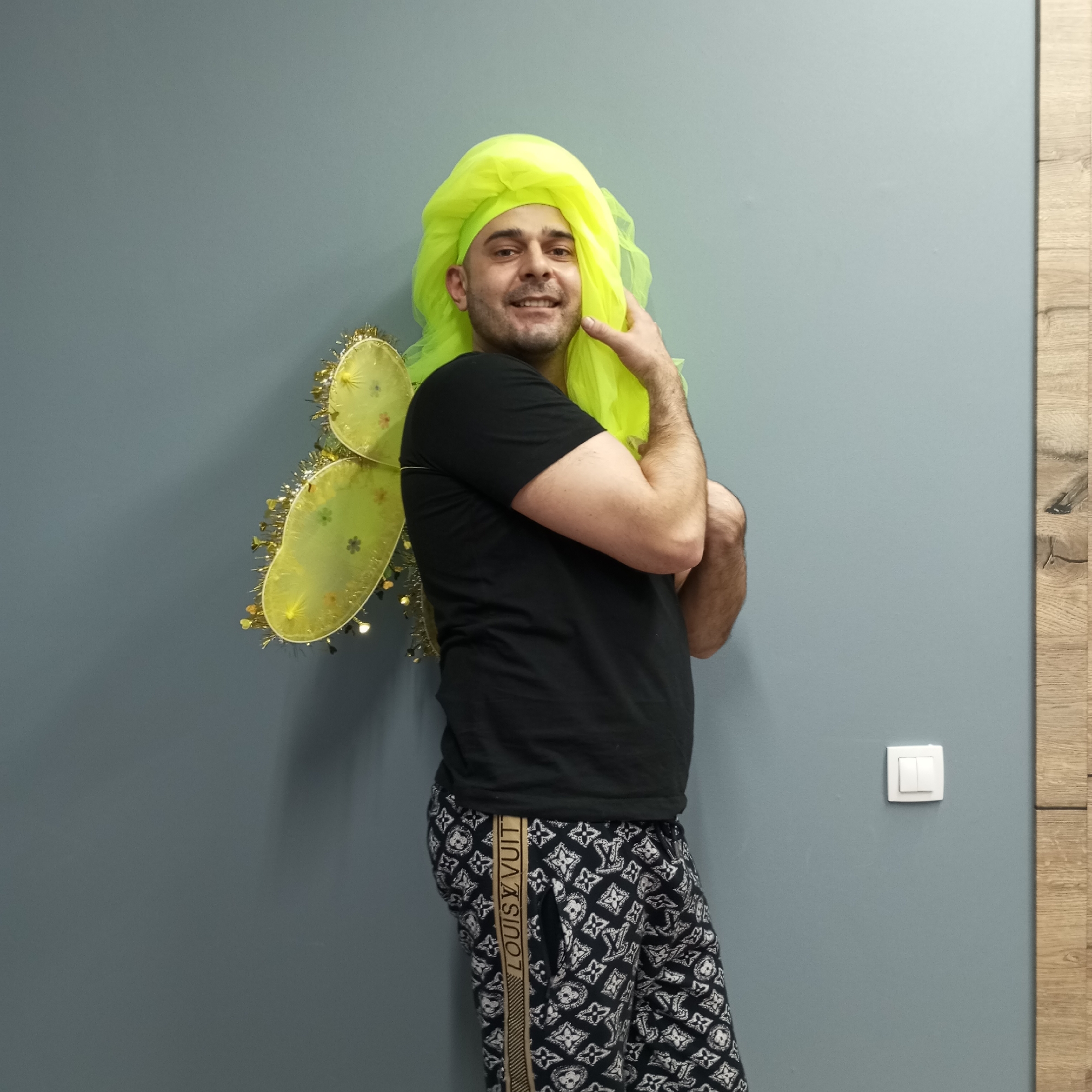 Person poses in costume changes during indoor photo session