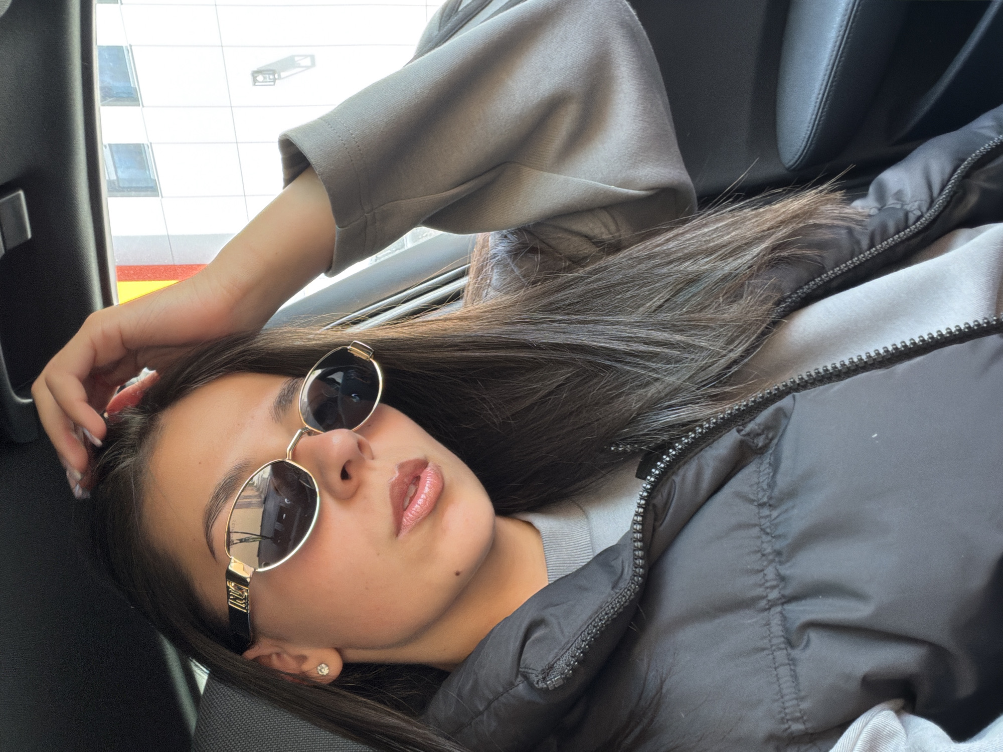 Woman rests in parked BMW in Gabrovo, Bulgaria