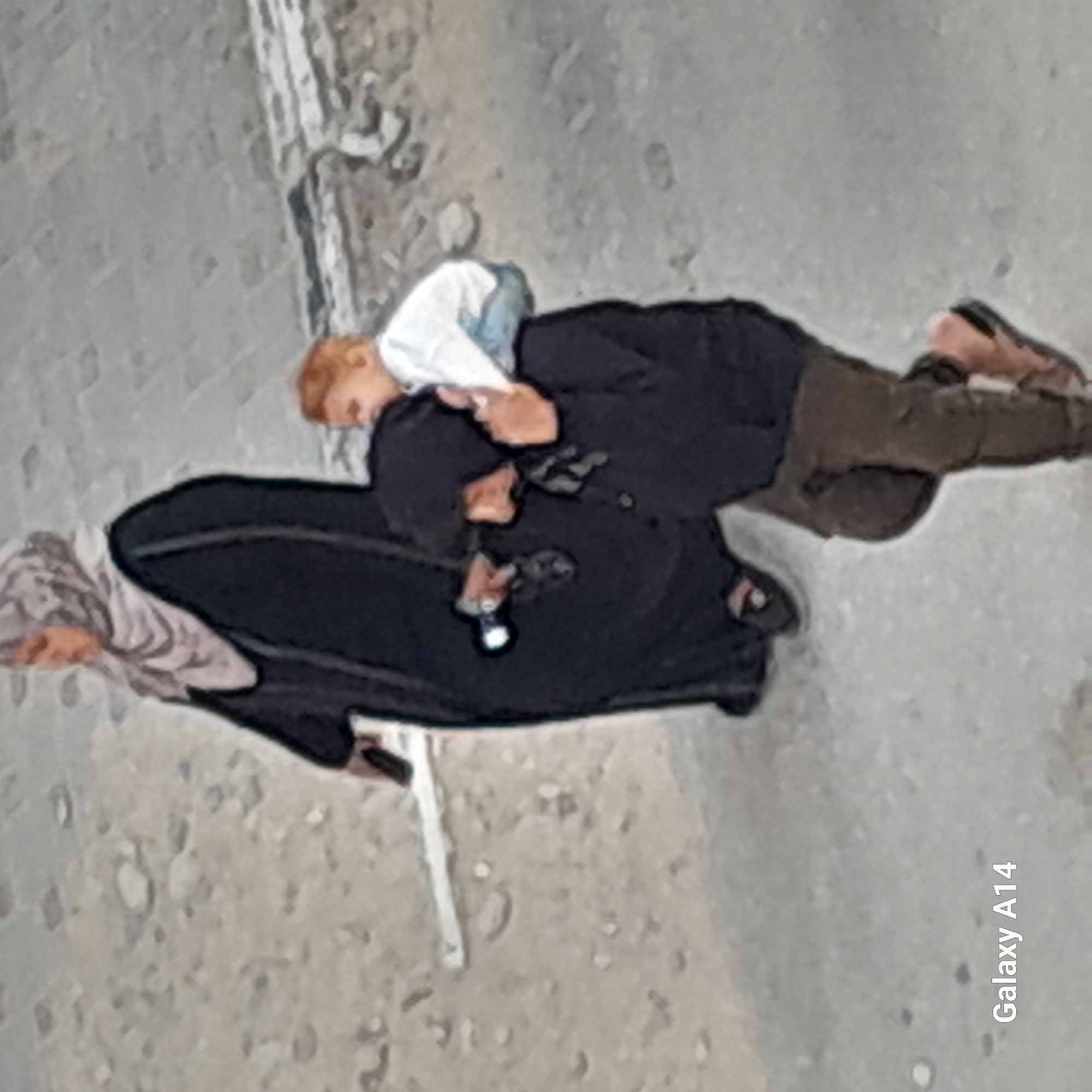 Family group observed walking on urban concrete surface
