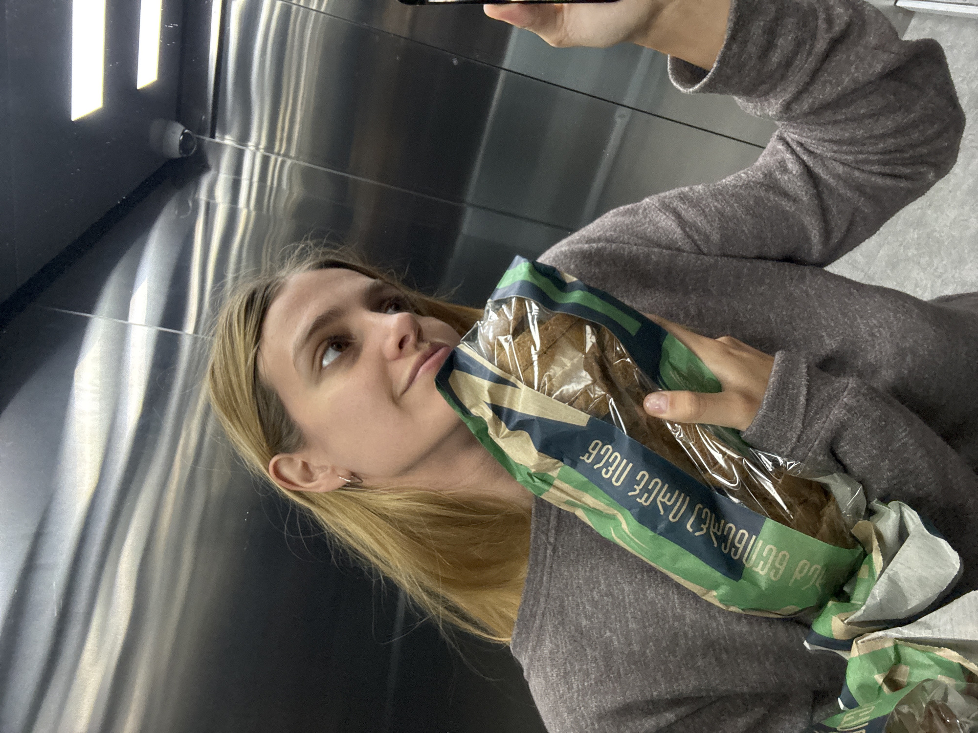 Woman takes elevator selfies during morning hours