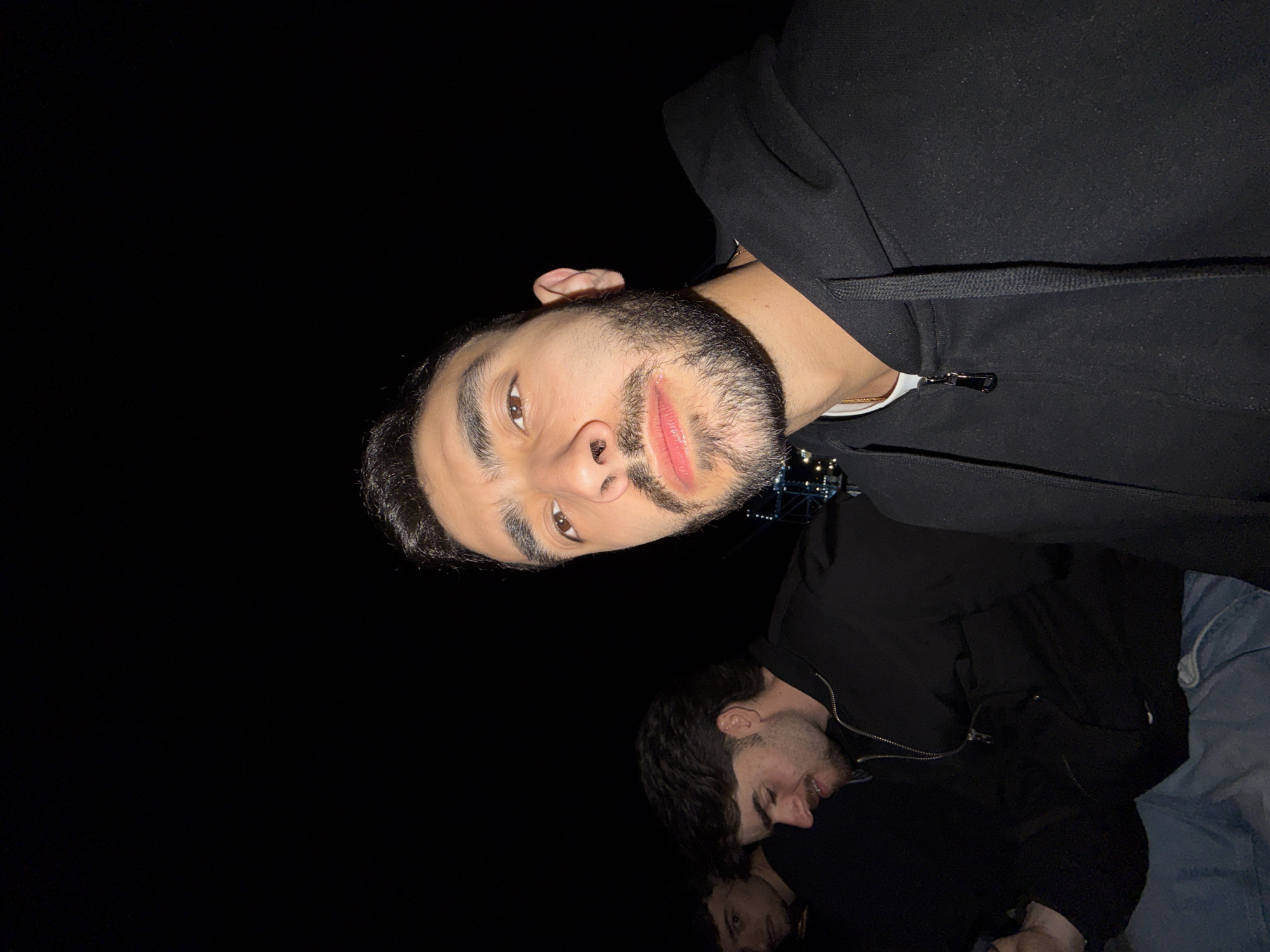 Three friends photograph together during night out in Rijeka