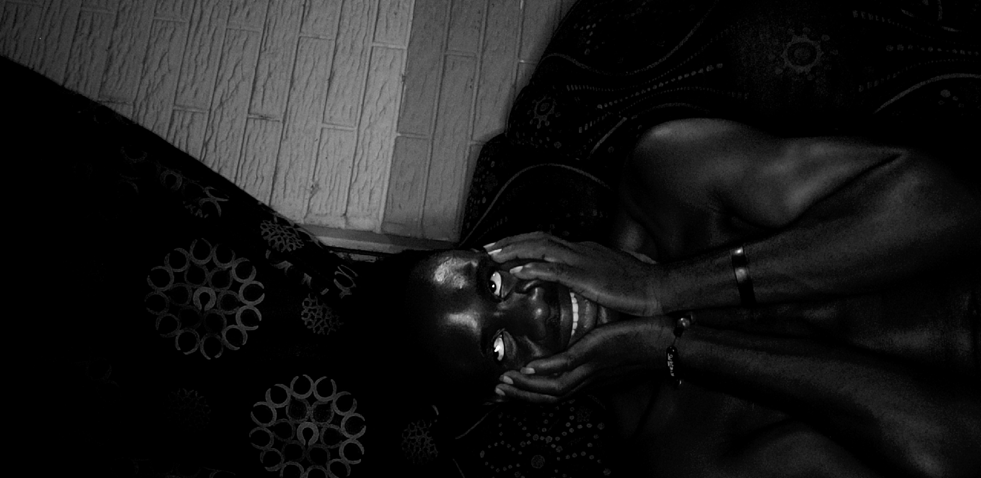 Person photographed relaxing on sofa in Narayi, Nigeria
