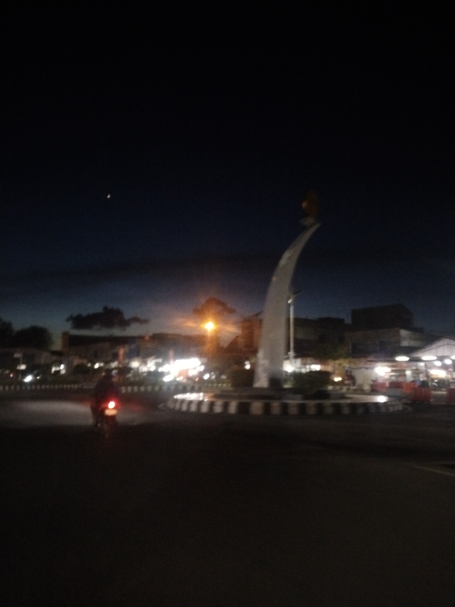 Nighttime roundabout monument captured in Lhokseumawe, Indonesia