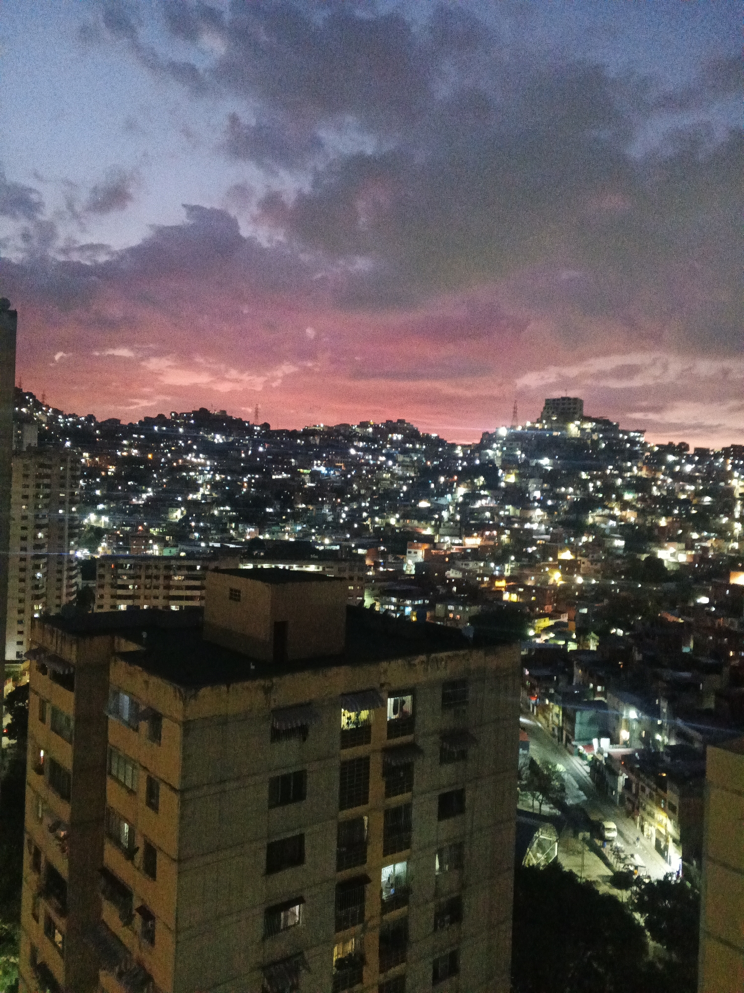 Nighttime urban cityscape captured from multiple elevated viewpoints