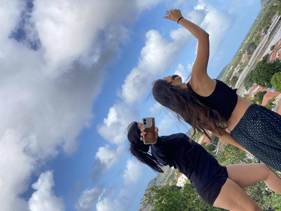 Tourists photograph scenic views, cattle in Venezuelan mountain towns