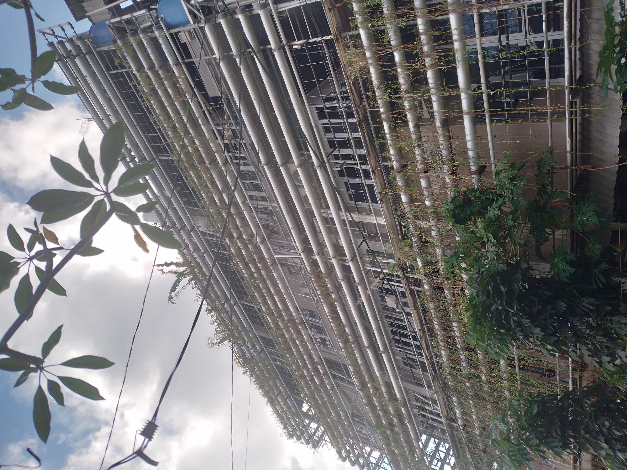 Building with silver vertical pipes documented in Kuta Selatan