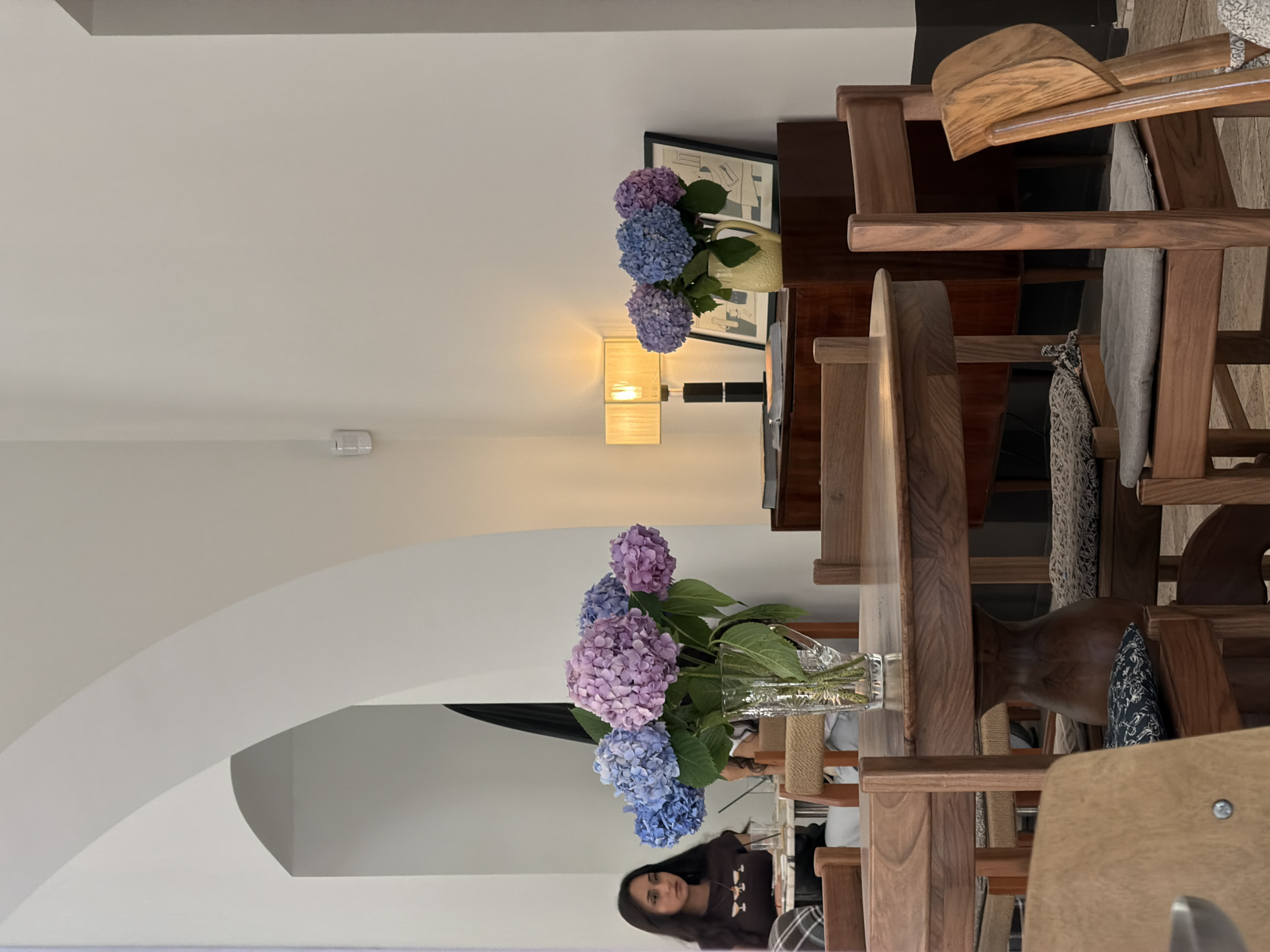 Inside a quiet Baku café, hydrangeas and pastries on display