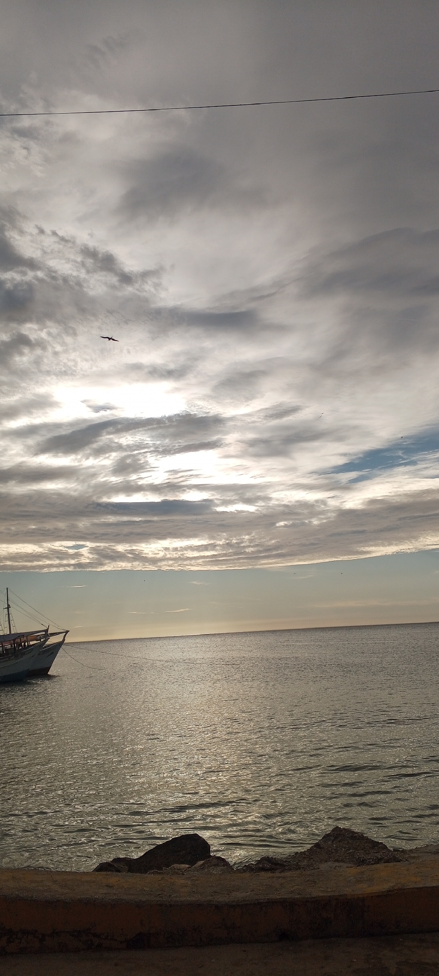 Juan Griego harbor at dusk, clouds and calm water