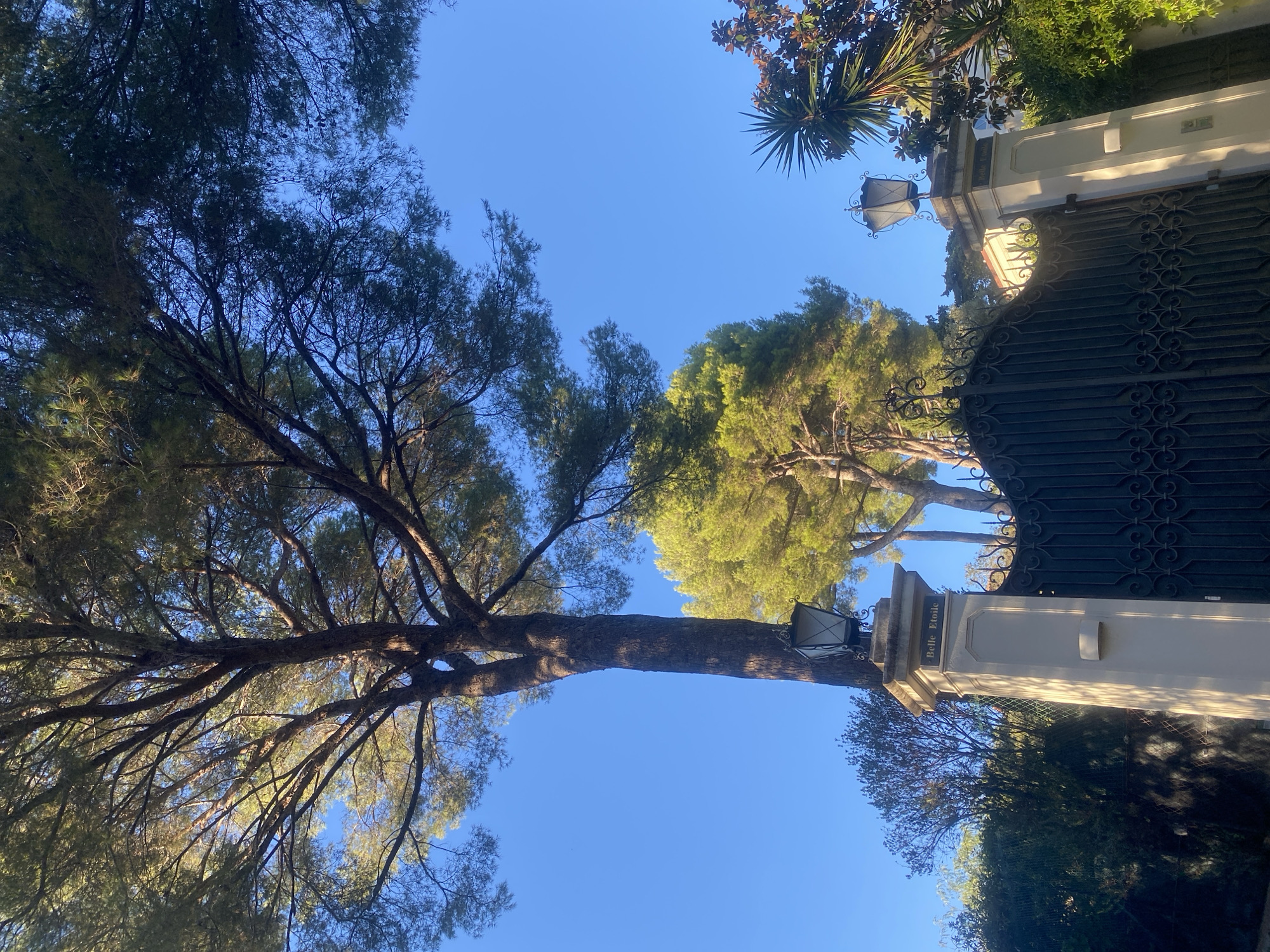 Antibes estate gates and coastal views on a clear afternoon