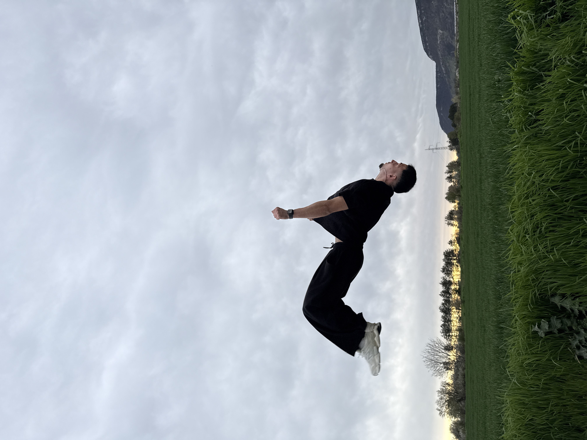 Man performs backflips in field near Shumen, Bulgaria
