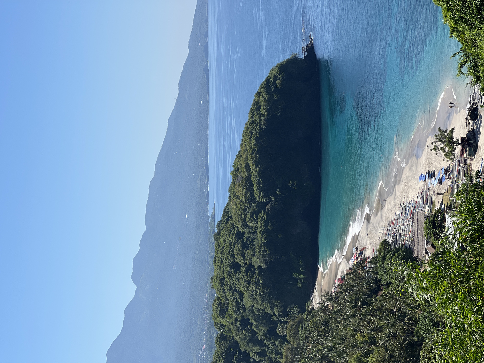 Hilltop views over Virgin Beach, Karangasem, with a roaming dog