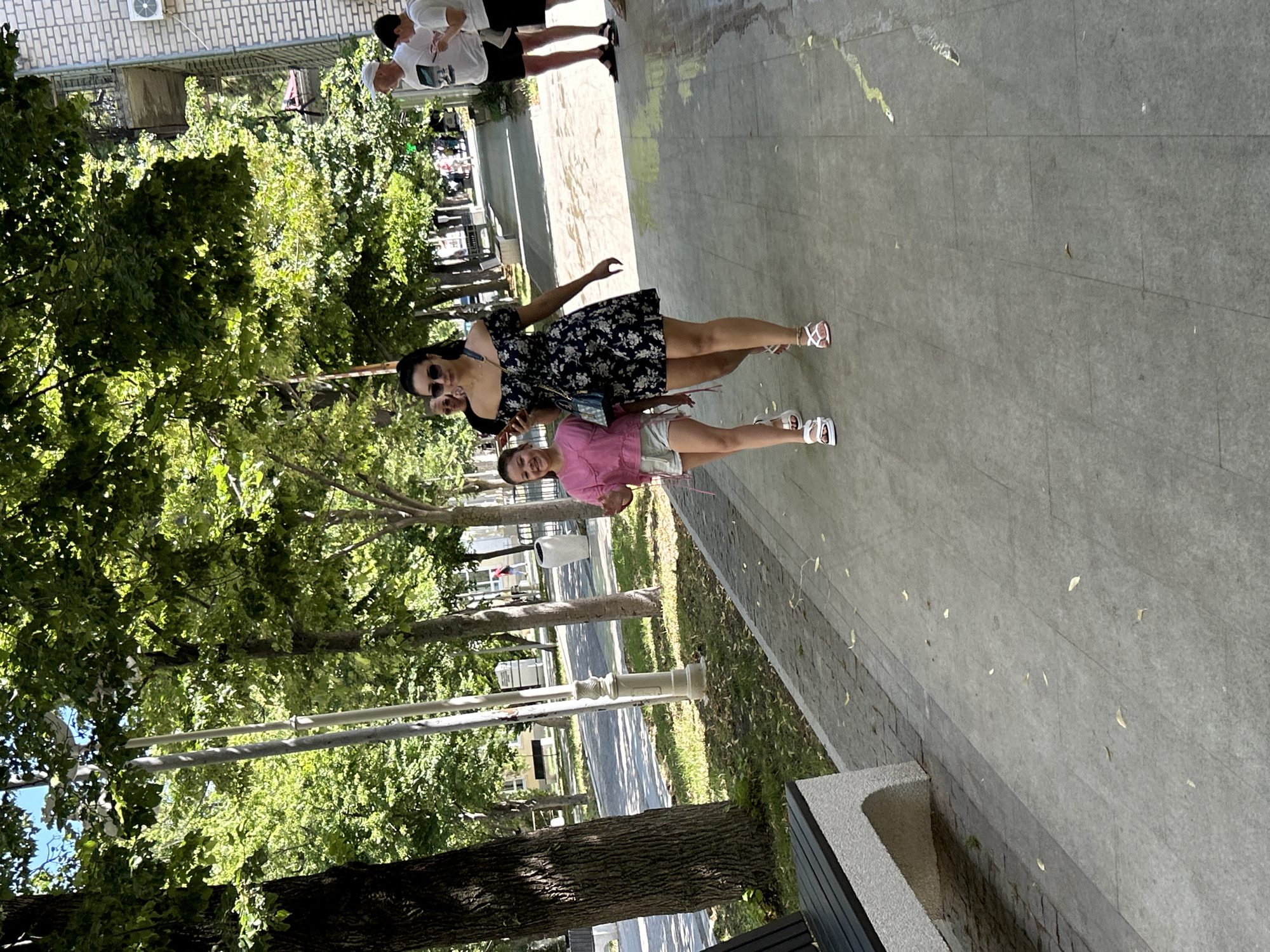Sunny morning foot traffic along Gelendzhik's tree-lined streets