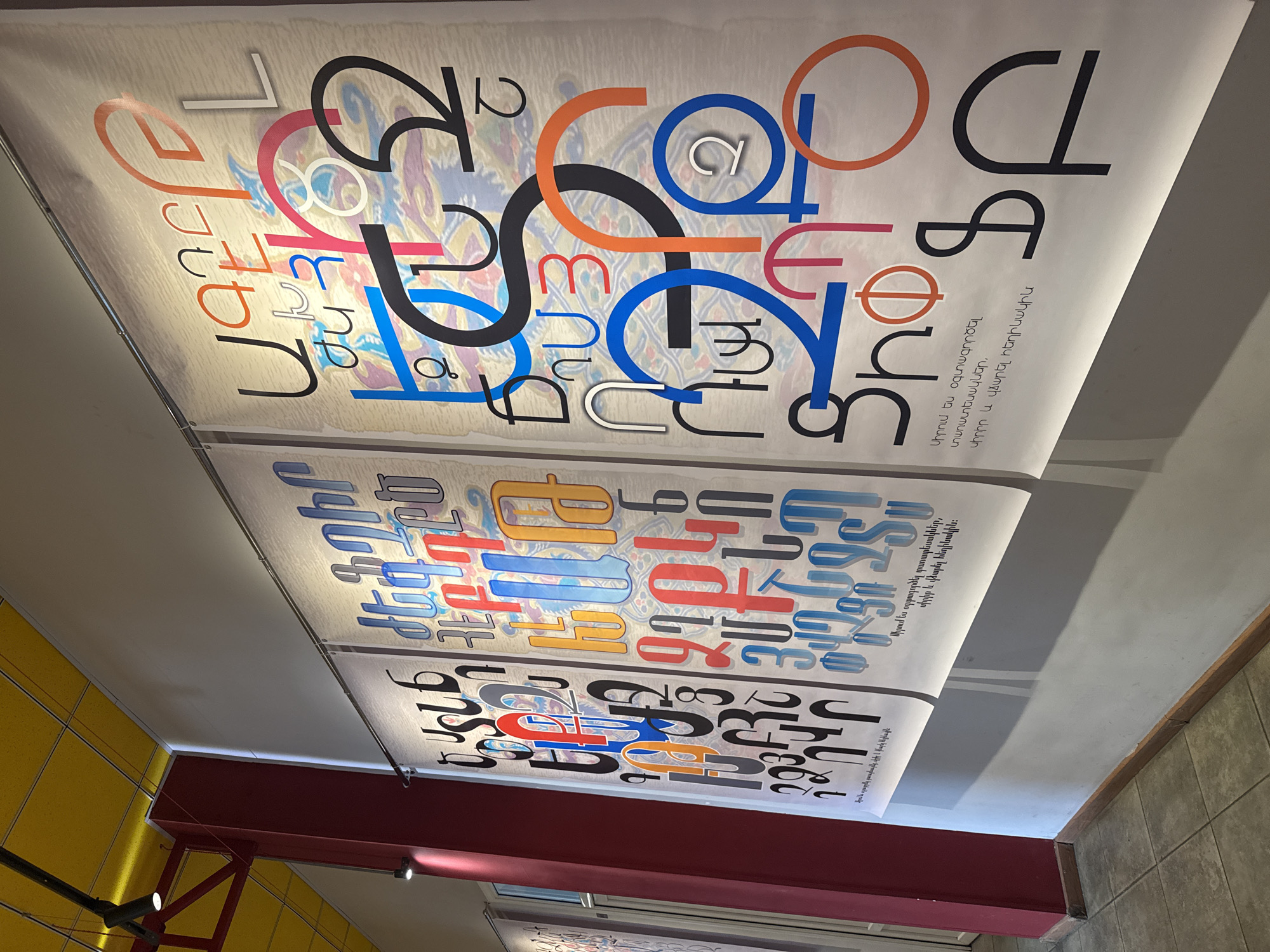 Art exhibition featuring Armenian typography and paintings documented in Yerevan