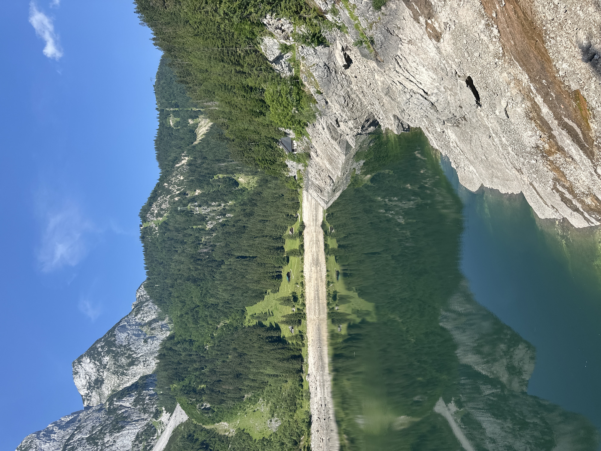 Sunny morning at Gosausee with butterflies and alpine reflections