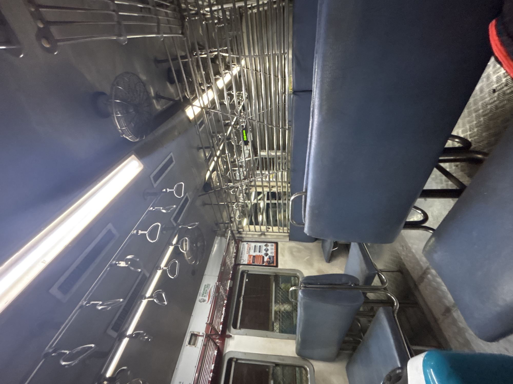Commuter train interior documented in Ambernath, India