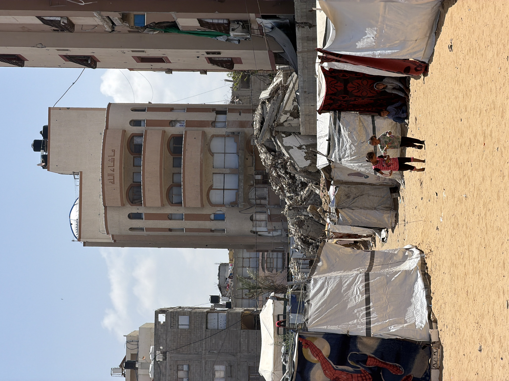 Makeshift displacement camps documented in Gaza under clear skies