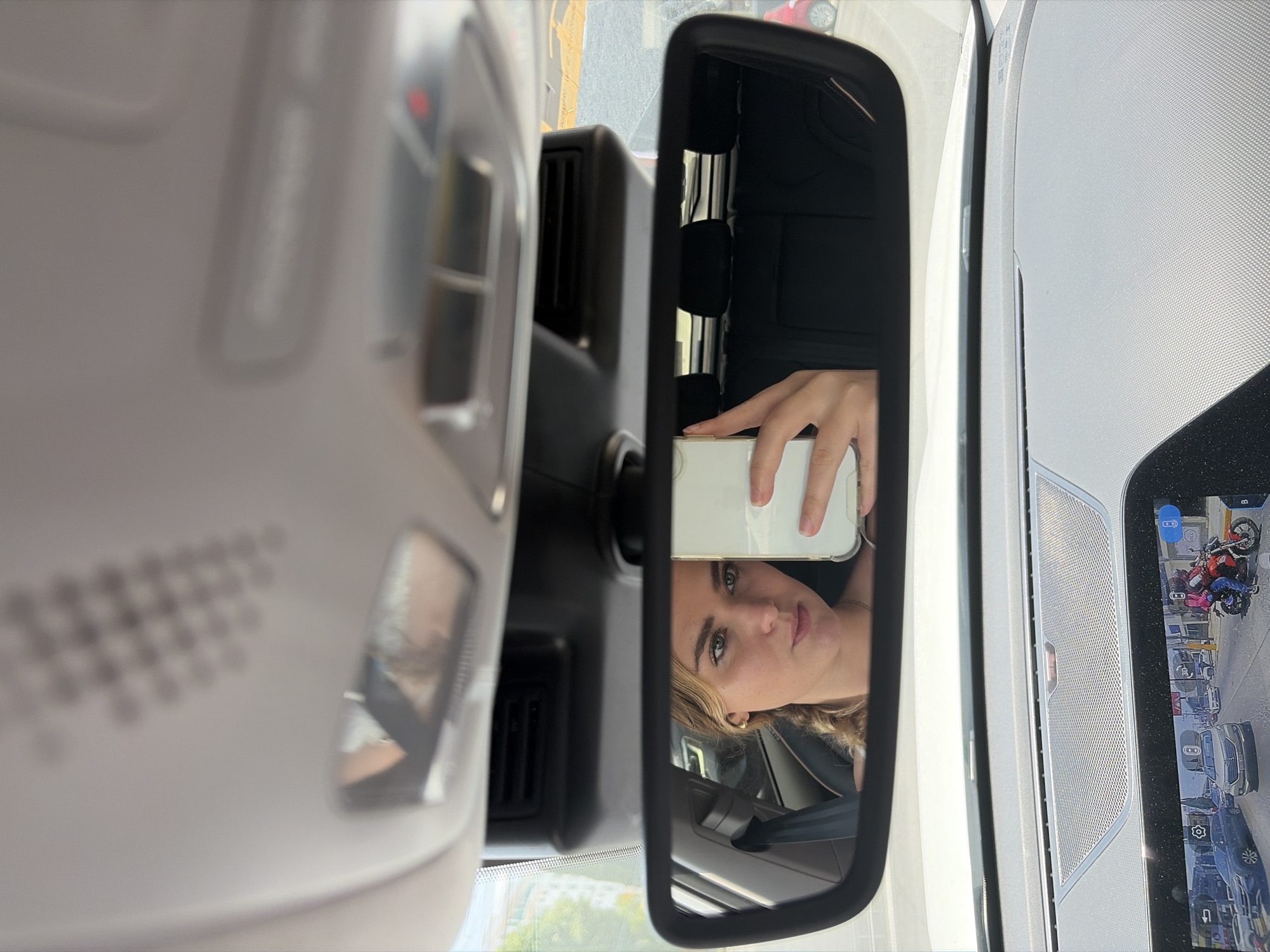 Woman takes car selfies in Puebla, Mexico