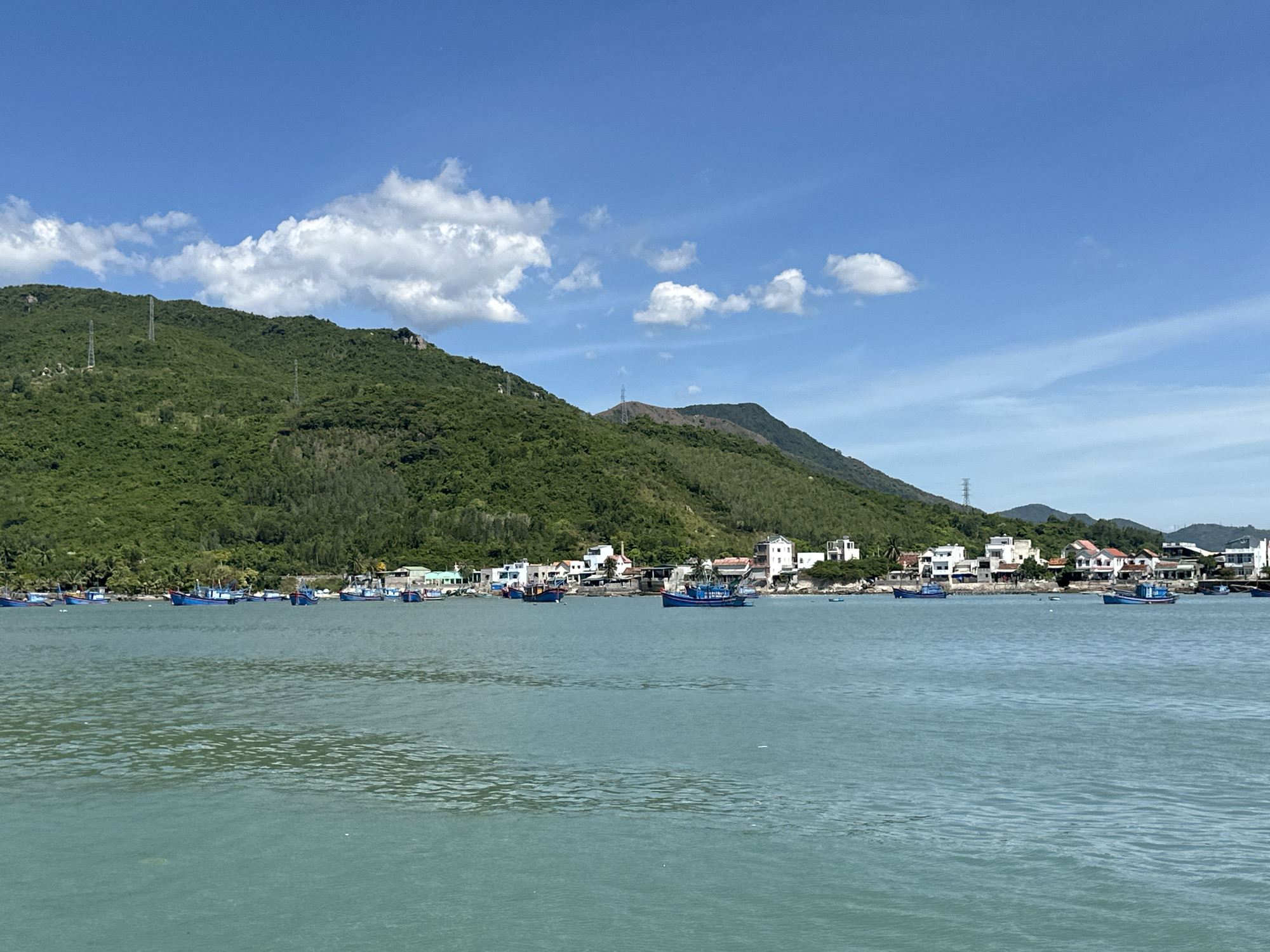 Boat trip along Vietnam's Ninh Hòa coastline on a clear day