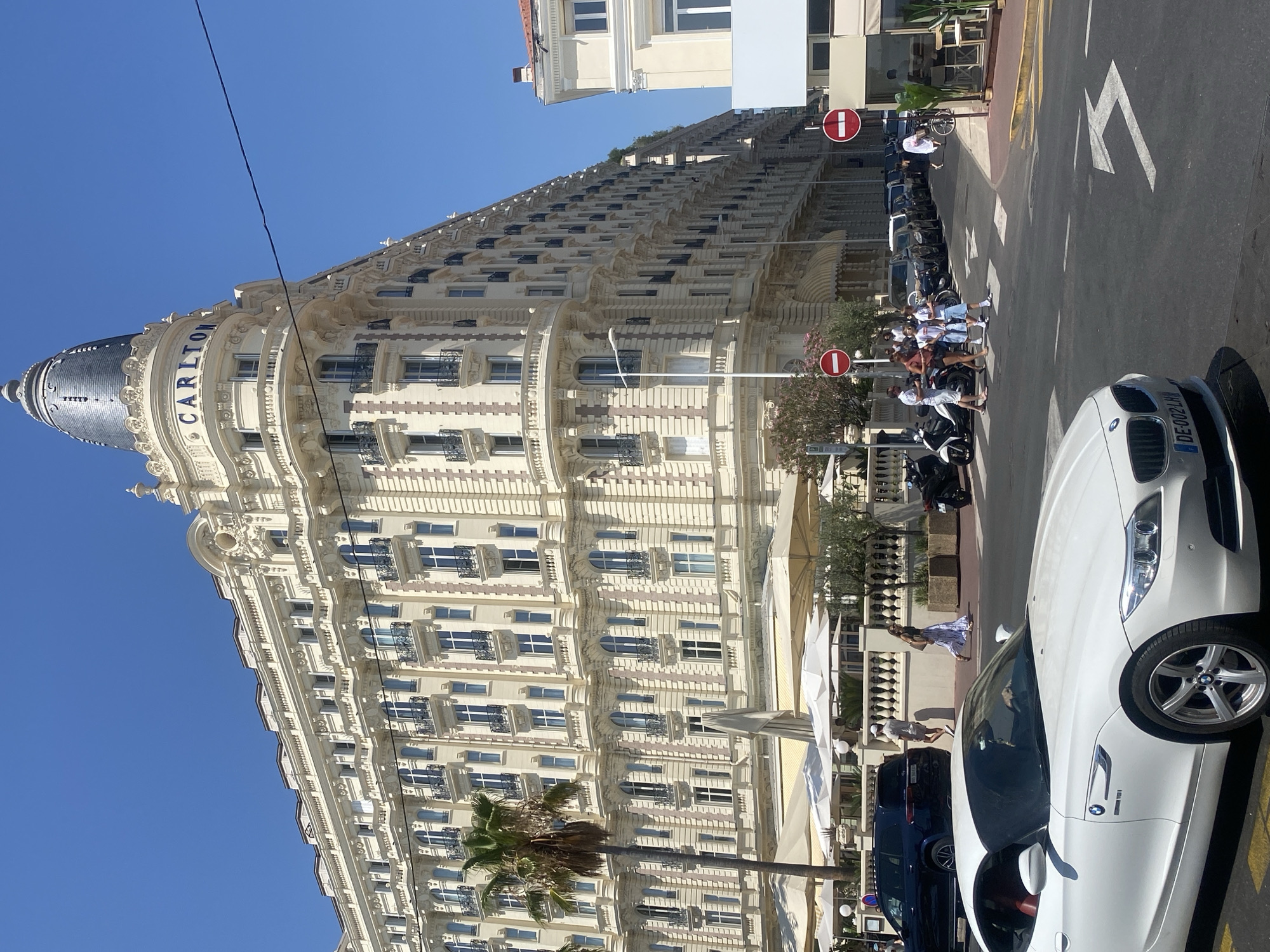 Carlton Hotel and Croisette beachfront on a clear Cannes afternoon