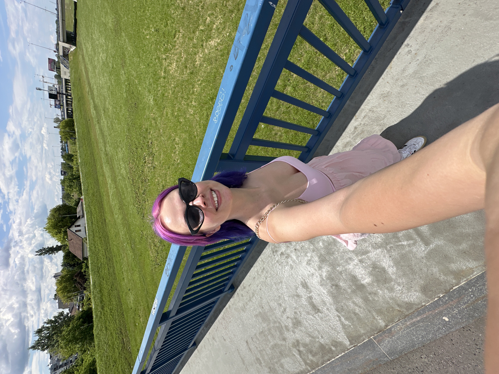Woman documents sunny day in Zagreb with colorful selfies