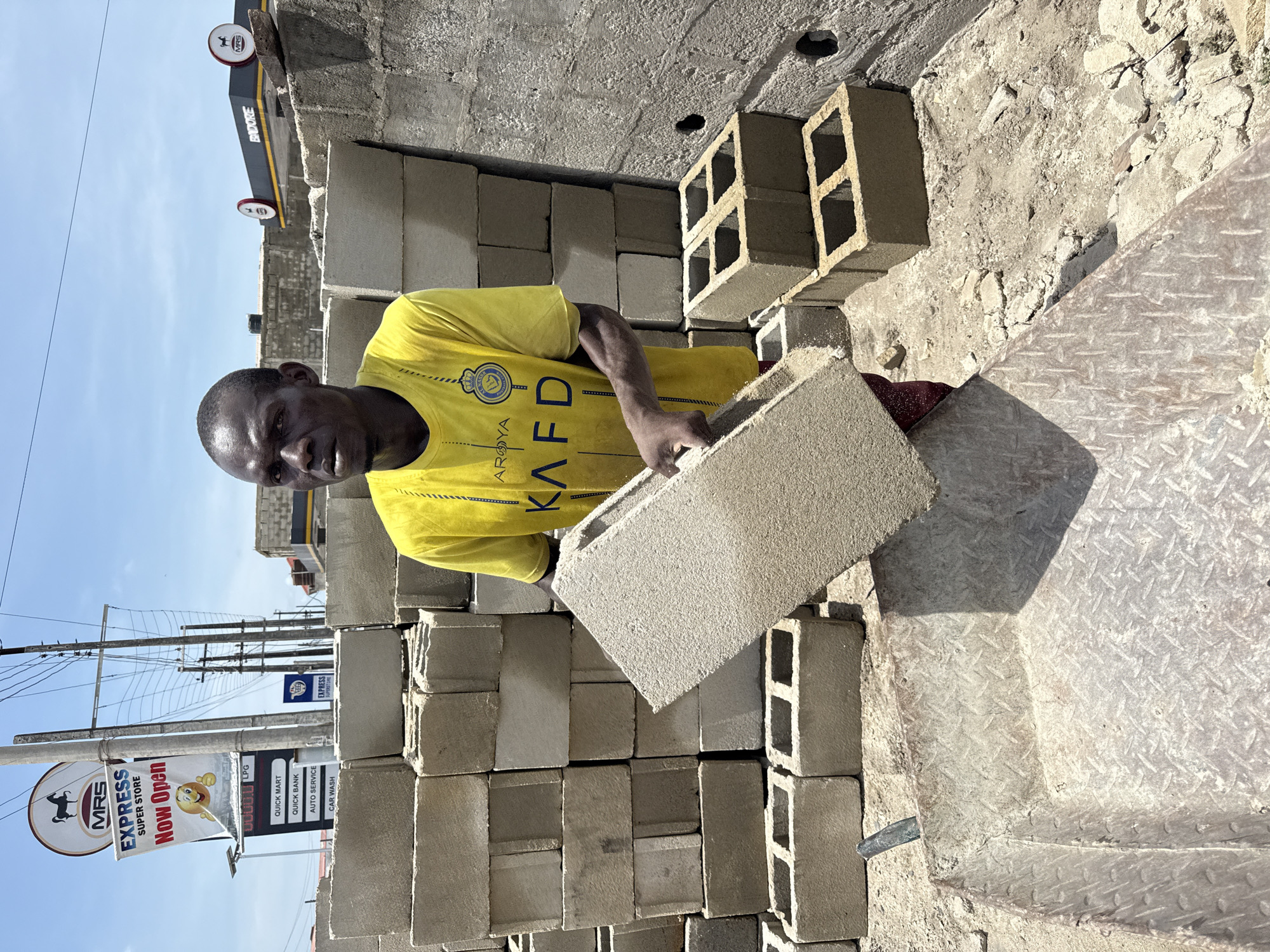 Workers clear demolition debris in Ado, Nigeria