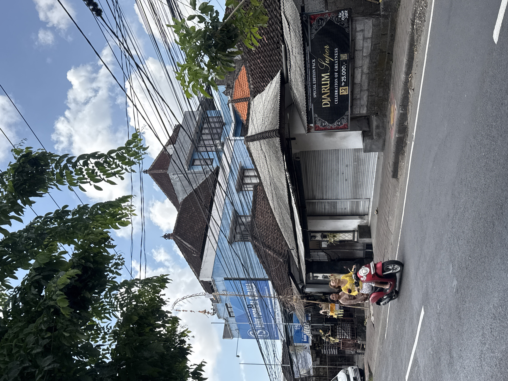 Everyday street scenes and international flags across Kuta, Bali
