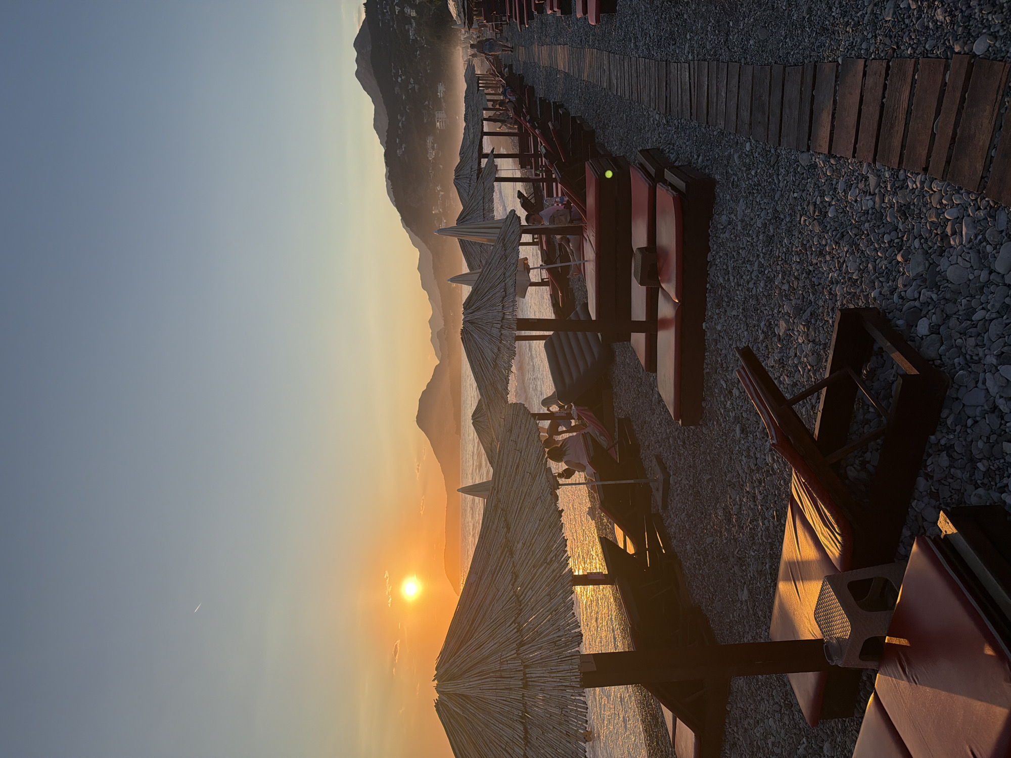 Sunset over Bar's beach, mountains on the horizon