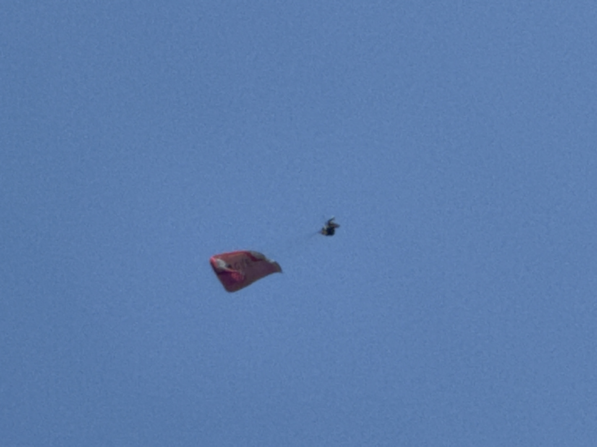 Paragliders fill the skies above the Montenegrin coast