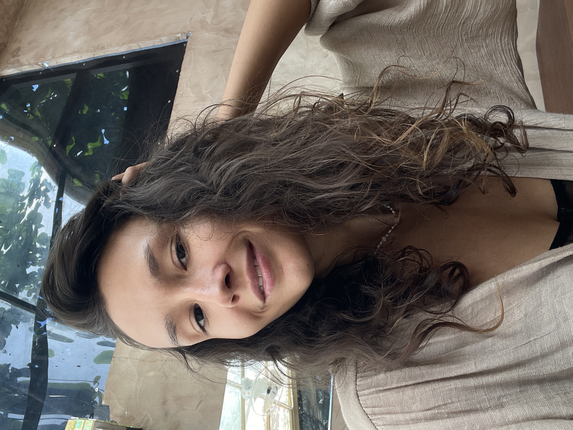 Woman enjoys morning coffee at Mũi Né cafe