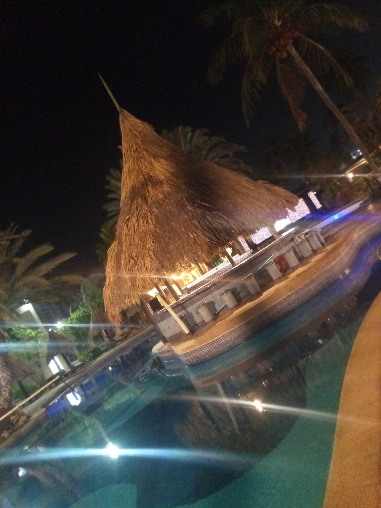 Night scenes captured at Porlamar resort pool area