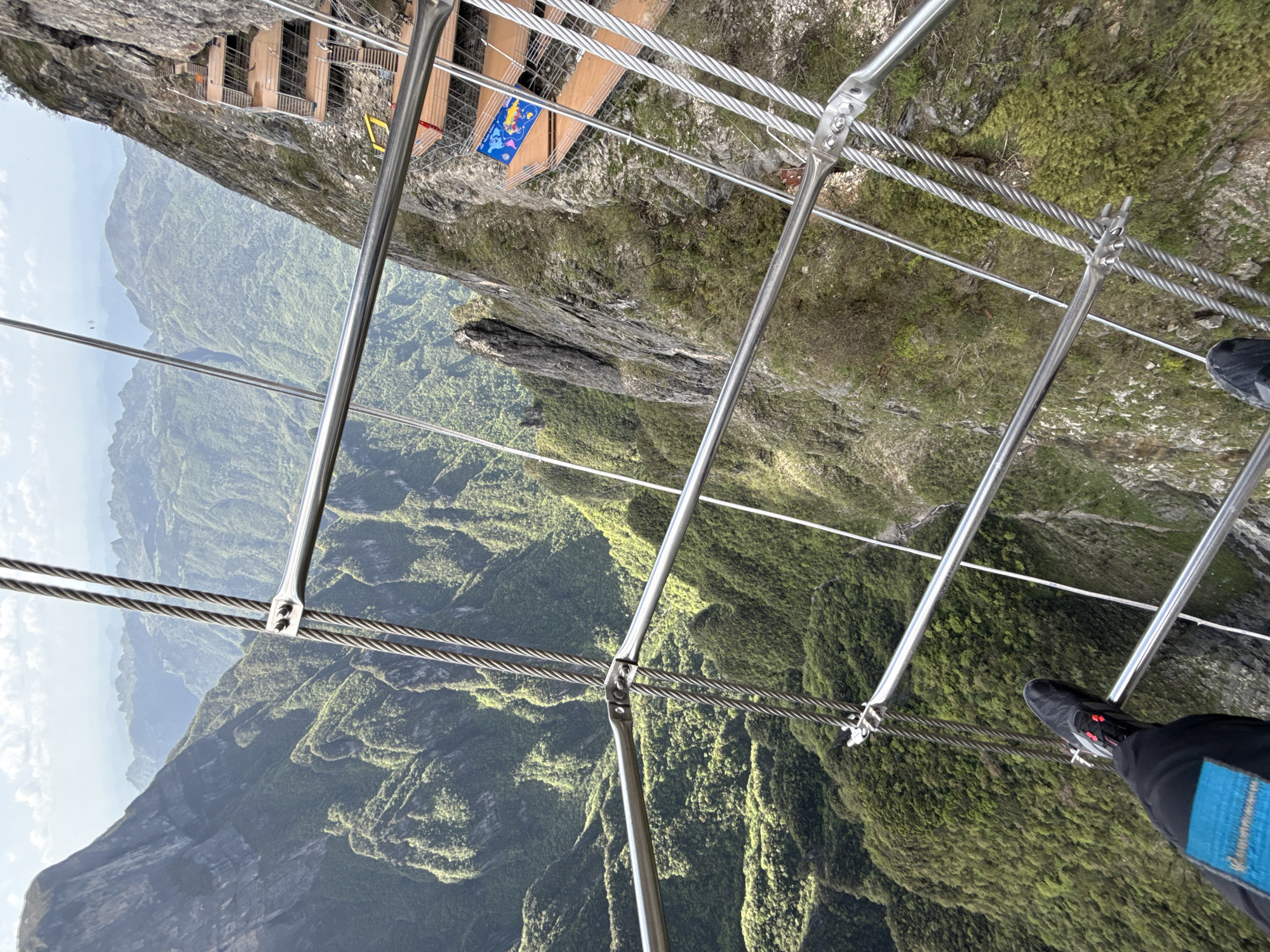 Person photographed on mountain bridge in Yongding District, China
